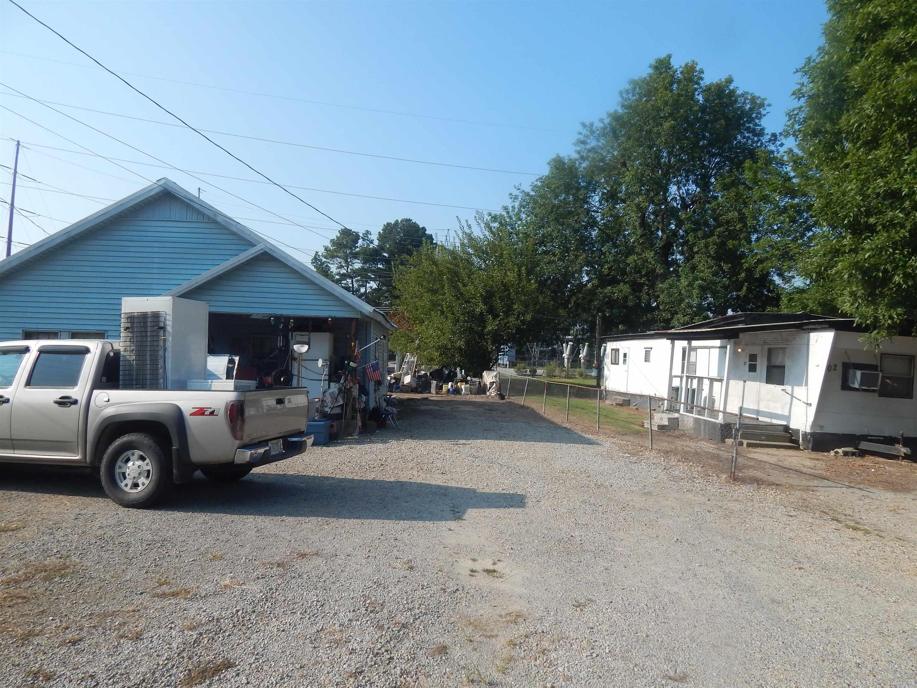 3br 1 bath home, window a/c, space heater-gas, has mobil home on lot also, 2br 1 bath, also has another lot that goes with property. all for one price.
