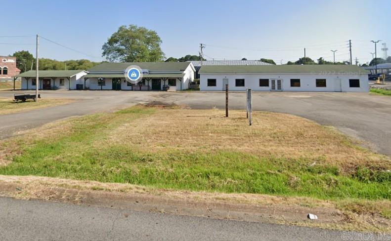 This centrally located commercial property in Searcy, Arkansas, presents a remarkable investment opportunity. Situated on a generous 1.34-acre lot near Harding University and boasting high visibility on one of the town's busiest roads, this offering includes two distinct buildings, opening up a wealth of possibilities. Imagine the potential for retail spaces, office complexes, or a combination thereof, capitalizing on the constant traffic and proximity to both the university community and the heart of Searcy. With ample space and a prime location, this property is a blank canvas awaiting the vision of its next owner to unlock its full potential and contribute to the thriving commercial landscape of the area. Building on the right is around 5,000 sqft, left is 2,400 sqft. C-4 zoning. SEE AGENT REMARKS.