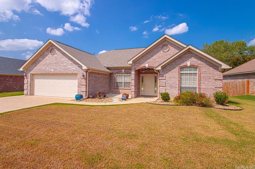 Located in Heritage Farm Subdivision, this spacious 3-bedroom, 2 full bath home offers over 1,950 square feet of living space. The living room features stylish laminate flooring, gas log fireplace, & tall ceilings. The primary suite provides a peaceful retreat with ample space, a large walk-in closet, and an en-suite bathroom with double sinks, jacuzzi tub, & walk-in shower.  Two additional bedrooms are well-sized with large closets.  The second full bath is conveniently located between the bedrooms, providing comfort for both family members and visitors. The bedrooms have newer carpet that provides added comfort and a fresh, updated look.  Outside there is large backyard with a nice covered patio!  Enjoy the perks of living in a neighborhood that includes a community pool & covered pavilion. The neighborhood’s well-maintained amenities and welcoming atmosphere make it perfect for families or anyone seeking a balanced lifestyle.  Heritage Farm is a prime location with easy access to the interstate, & equally located between Benton & Bryant!  This home blends comfort, convenience, and community living. Don’t miss your chance to make it yours!