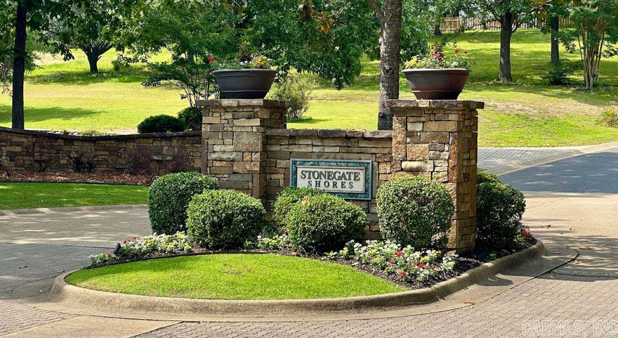 Welcome to your dream opportunity in the prestigious gated community of Stonegate Shores. Nestled in a tranquil and secure neighborhood, this lot presents an extraordinary canvas to build the home of your dreams.  Spanning 17,056 square feet, this expansive lot provides ample space to create a custom-designed residence that perfectly suits your unique vision and preferences. The rolling topography of the lot opens up a world of possibilities for creative landscaping, allowing you to craft your own private oasis within this gated paradise. This exceptional gated community offers a wealth of amenities and an unparalleled sense of community. Whether you're taking a refreshing dip in the community pool, engaging in friendly matches on the tennis courts, this community also provides access to a private boat ramp as well as being located in one the states best school districts.