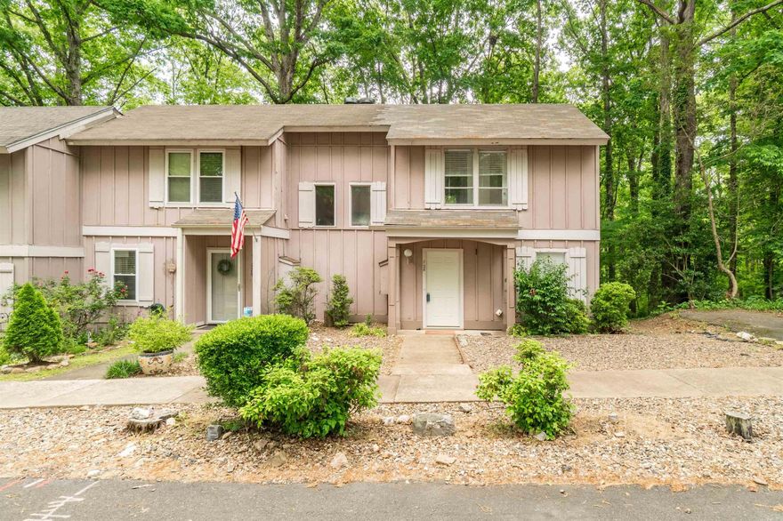 Main level includes living/dining room, kitchen and half bath. Upstairs you will find 2 bedrooms, full bath and laundry area. The appliances stay with this home - new water heater in 2021.   Freshly painted, new LVP downstairs.  Carpet up the stairs and entire second floor.  Right end unit offers a bay window in the dining area.  Back deck new last year and roof is days old.  Heat pump is under service agreement with Climate Control. Convenient area of Hot Springs Village near golf, outdoor swimming pool, restaurants and shopping and so much more......