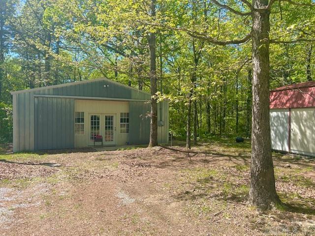 Welcome to the market this 2 bedroom 1 bath Cottage on nearly 5 acres. A Hidden Gem. Tucked away behind what appears to be a shop front, this unique cottage offers cozy living with room to roam. Set on 4.55 acres of private unrestricted land with it's own private driveway. This home features a storage building. Home is only a short drive to either Mountain View and Heber Springs. Both having lots to offer. Mountain View is known for folk music on the Courthouse Square as well as many other attractions such as The White River, Blanchard Springs Caverns and much more. Heber Springs is know for that Beautiful Red River and Greers Ferry Lake. Many possibilities here. You could live here and build a bigger home or you could rent and use as your very own retreat. Call today to see this Hidden Gem for yourself.