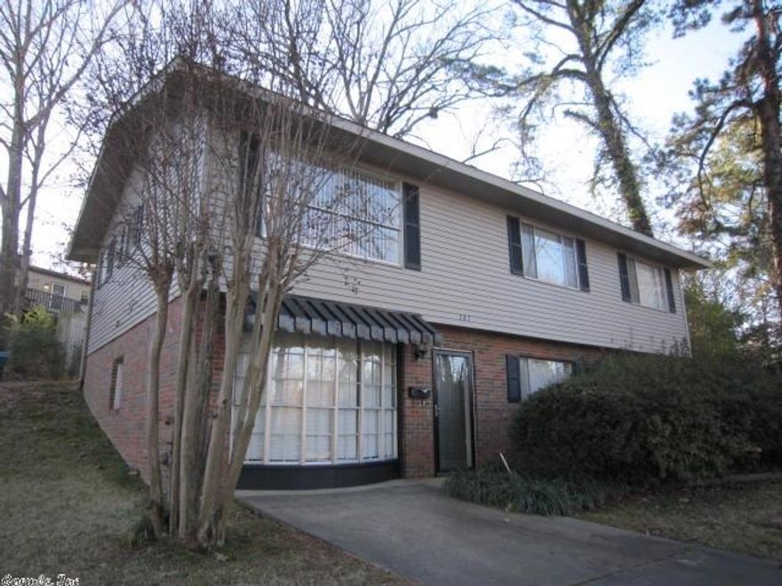 Conveniently located West LR 4 Bedroom, 3 bath home w/hardwood floors, 2 living areas & across from Birchwood Park-playground, basketball court, gazebo, picnic area. Cute eat-in kitchen with French door to back deck.  2 parking pads-one is just outside the kitchen door and the other in front of house.  2 levels: Front parking/Street level has den, laundry room, one bedroom & one bath.  Back parking/Upper level-kitchen, large living room, 3 bedrooms & two baths.  Two zones of heat/air.  SEE AGENT REMARKS.