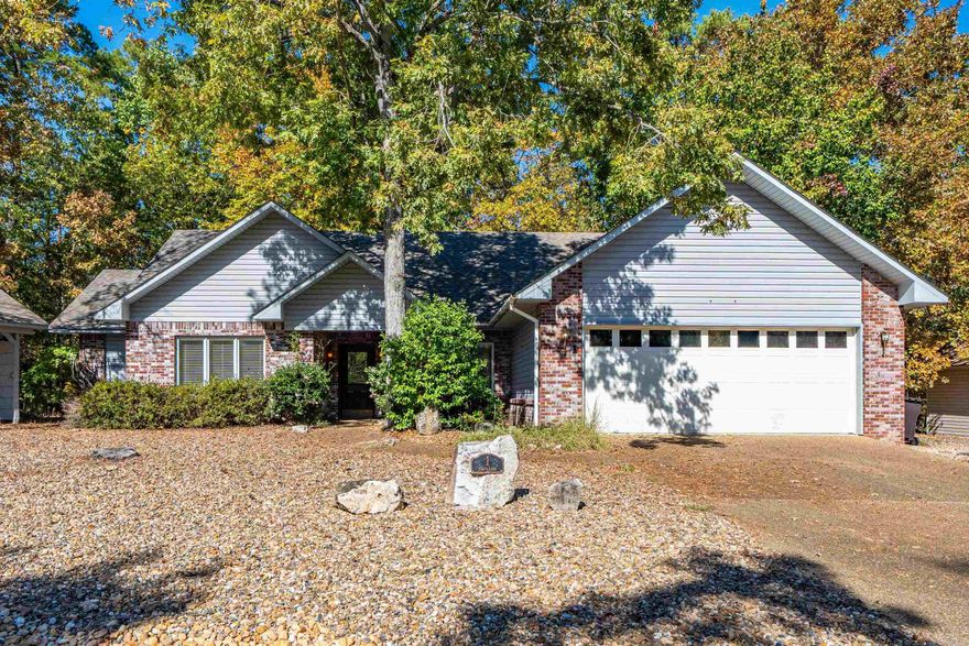 Pristine 3 Bed/2 Bath Gem with Seller-Paid Village buy in Fee! Discover effortless living in this beautiful 3 bedroom, 2 bathroom home with beautiful fireplace. High ceilings and beautiful features. Enjoy the peace of mind of a new roof (2021) and new HVAC (2021), plus the seller is paying the $2,000 Village buy-in fee! This home sits on almost a quarter of an acre and features a nearly maintenance-free yard and a two-car garage. The interior is turn-key—both refrigerators, the washer, and the dryer will convey with the home. Located in beautiful Hot Springs Village, you get easy access to close shopping and benefit from all the amenities the community has to offer, including golf, lakes, and walking trails. Don't wait! Schedule your showing today.