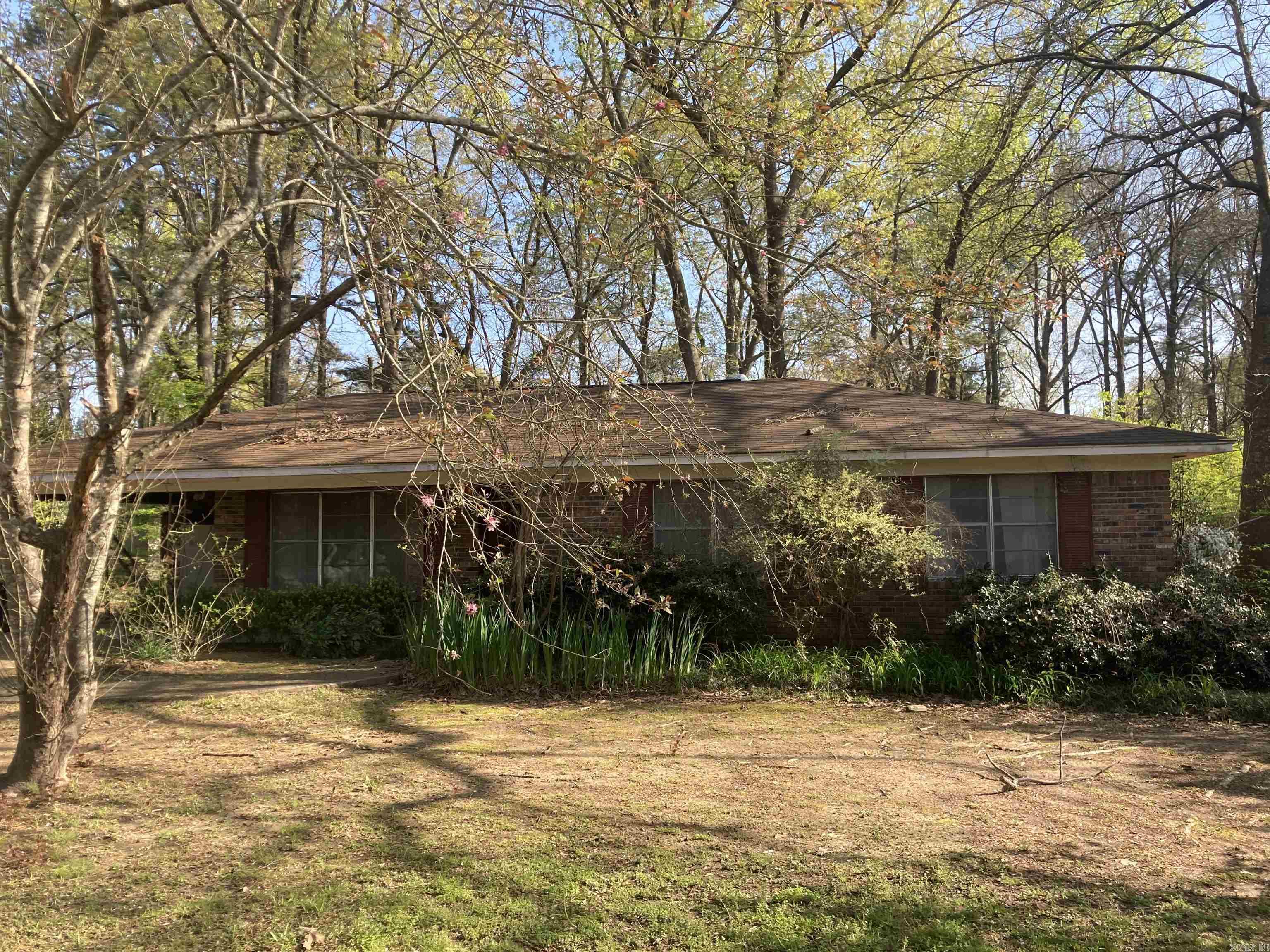 Home located in Rolling Acres subdivision, a well established neighborhood in West Crossett,Ar. This home features 3 bedrooms, 1 full bath with shower,tub combo, and other bath is plumbed for a shower to be added as well. It has a living room as well as a large den that was added on which has a gas log fireplace and built ins on each end of room and a cedar closet. There is a laundry room off the kitchen as well with room for storage. Roof is within 10 years. House was replumbed in 2017. The central ac system has been serviced every year as well. There are 3 lots with this property including home site, an extended lot behind home and a small parcel down from home where sellers had a garden. The home is being sold As-Is.