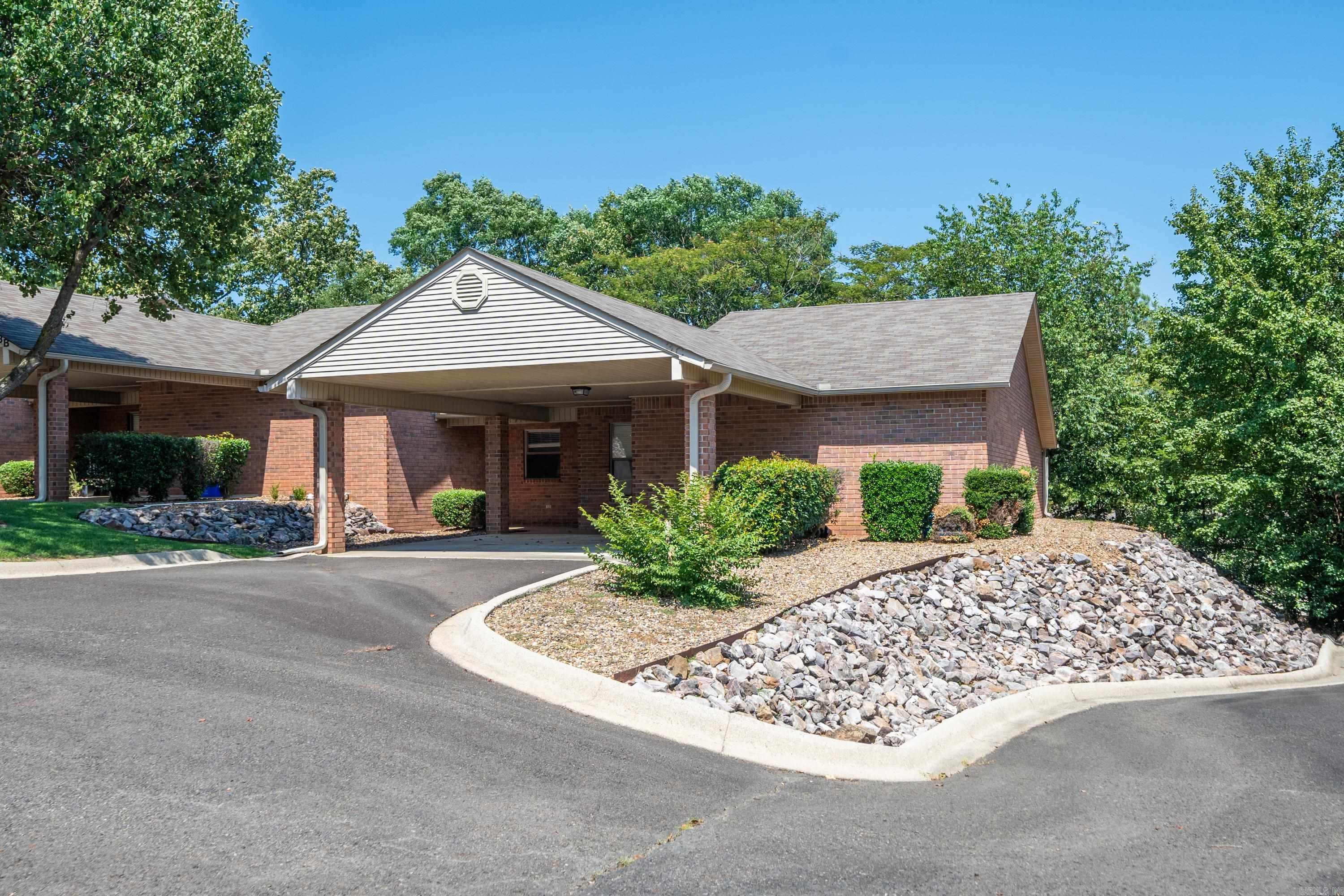Enjoy the easy life in this one level, move in ready condo. These units rarely come on the market. Close and convenient to everything with 2 bedrooms, 2 baths and 2 car carport. Solid surface flooring in main living area and adorable covered back patio with low maintenance yard. Master suite with access to back patio. The Oaks is a 55 plus community offering well maintained grounds in a park like setting and a clubhouse to get together with friends and family.