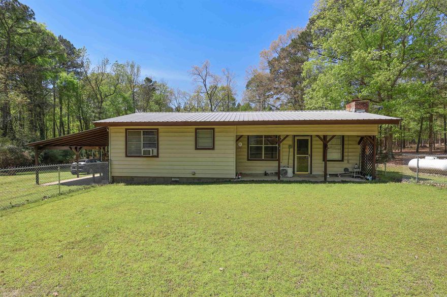Located just a few miles outside Arkadelphia, this 3-bedroom, 2-bath home sits on approximately 1.62 acres and offers a great opportunity for buyers looking for a property with potential. The home features a functional layout and is ready for updates and improvements to make it your own. A portion of the front yard is enclosed with chain link fencing, providing a secure space for pets or outdoor use. Additional improvements include a pole barn and a metal RV carport, offering ample storage and covered parking. Agent related to seller