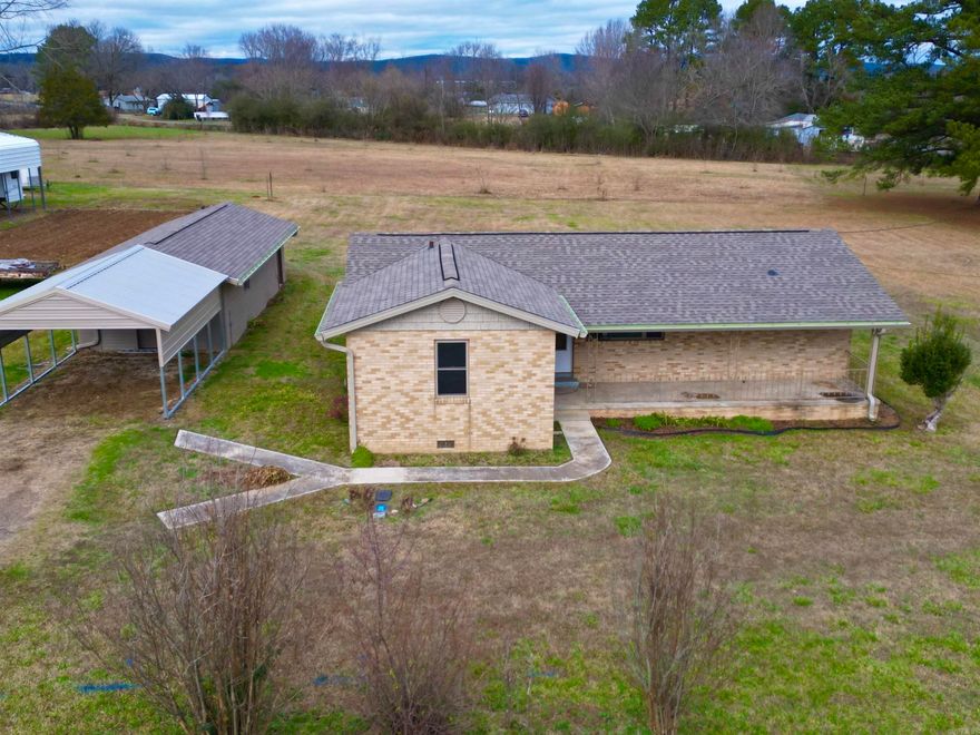 Discover tranquility in this meticulously remodeled 2-bed, 1-bath home nestled on 3.8 acres in a rural town near the Ouachita River. With a new roof, windows, HVAC unit, and back up propane heating, this move-in-ready haven offers modern comfort in a well-insulated space. Enjoy the convenience of city water, an insulated garage with electricity, highway frontage, and a close-knit community ambiance. Embrace the allure of serene living in this thoughtfully updated retreat.