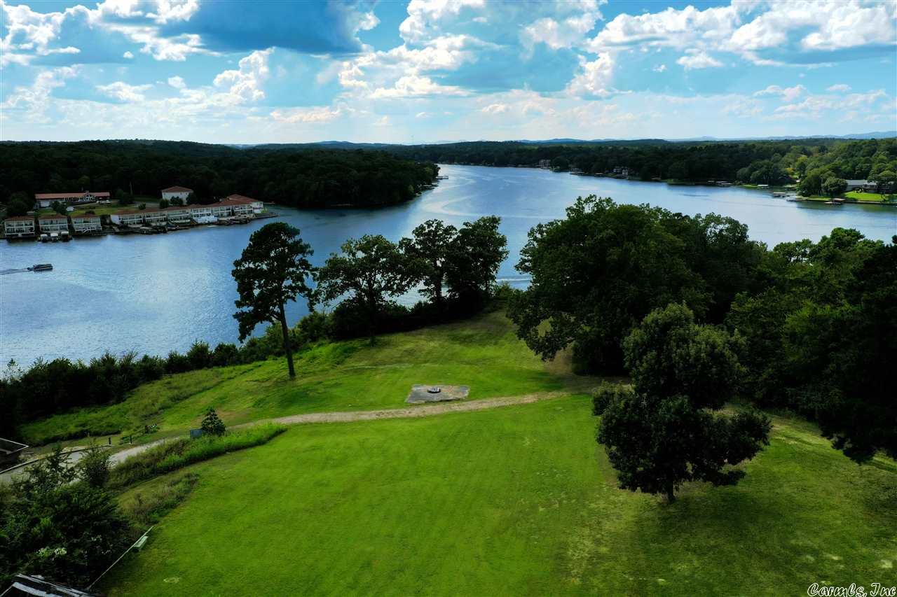 Breathtaking panoramic views, 4.8 acres with 374’ of lake frontage, the most remarkable spot available to build your Lake Hamilton Dream Home! WOW! Unbelievable sunsets right out your back door! This highly desirable location has INCREDIBLE views of miles down the main channel and the 70W bridge. This property offers a rare opportunity for you to own a piece of Heaven… Lake Living… your dream of a lifetime. Included on the property is a 40’ x 100’, 4,000 sq. ft. metal storage building.