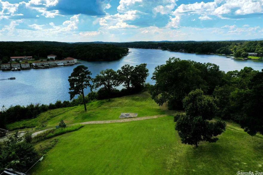 Breathtaking panoramic views, 4.8 acres with 374’ of lake frontage, the most remarkable spot available to build your Lake Hamilton Dream Home! WOW! Unbelievable sunsets right out your back door! This highly desirable location has INCREDIBLE views of miles down the main channel and the 70W bridge. This property offers a rare opportunity for you to own a piece of Heaven… Lake Living… your dream of a lifetime. Included on the property is a 40’ x 100’, 4,000 sq. ft. metal storage building.