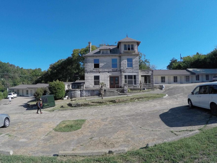 An amazing income producing property in a prime location in the heart of Downtown Hot Springs is waiting for an investor to add it to their portfolio. 18 units feature an open floor plan with a private bathroom and 8 one-bedroom units. The large Victorian style home, built in 1891, is 5295 square feet and could be renovated back to her glory days. Entry building by the highway could be a guard shack, quick convenience store or a storage building. There are 3 units dedicated for housekeeping, storage and managers office, but they could be configured to income producing units as well.  Owner requires earnest money with all offers and additional monthly expenses for cable and dumpster, can be supplied upon request. Call your agent today to schedule to see your next investment.