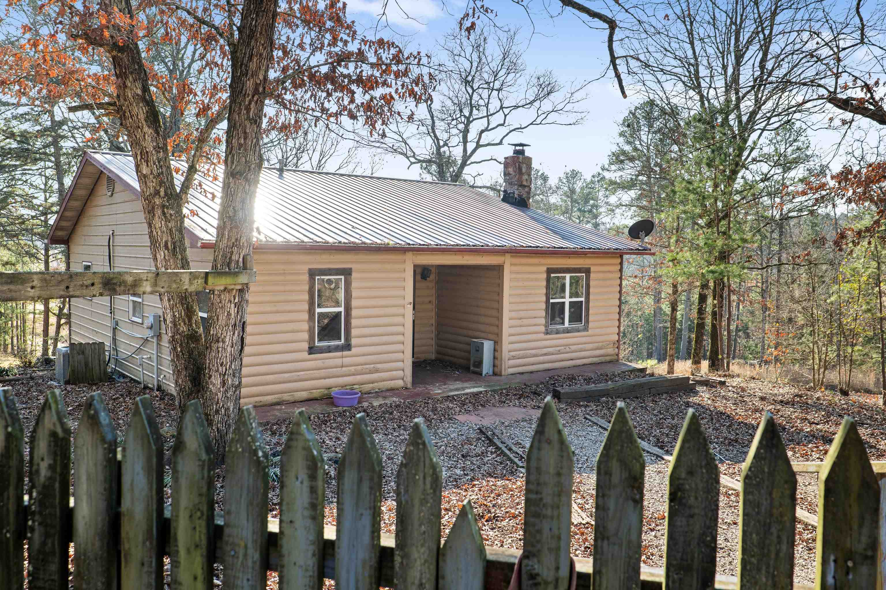 Charming Country Homestead Nestled on just over 5 acres of land, this homestead property offers an opportunity to step into country living and self sufficiency that is set up and ready! Log-siding exterior invites you inside, where youāll find a rustic, warm, inviting living room featuring a glass front wood stove-perfect for cozy nights in front of the fire. The heart of the home is a spacious, country-style kitchen, ideal for making memories. Main floor includes a large bedroom, full bath with walk-in shower, & easy access to the covered back porch. Step outside and enjoy serene views, where wildlife such as deer, turkey, and a variety of birds can be seen regularly. Downstairs, youāll find two additional bedrooms, a full bath, and a cozy den. Outside, the homestead truly shines with its impressive features: a chicken coop, a shop, an old barn, & two expansive, fenced garden plotsācurrently maintained using organic gardening practices. While this home is priced to sell "as-is," itās move-in ready and brimming with potential! A few deferred maintenance items may need attention, allowing the new owner to make it their own. Seller is motivated for a quick sale-make an offer today!