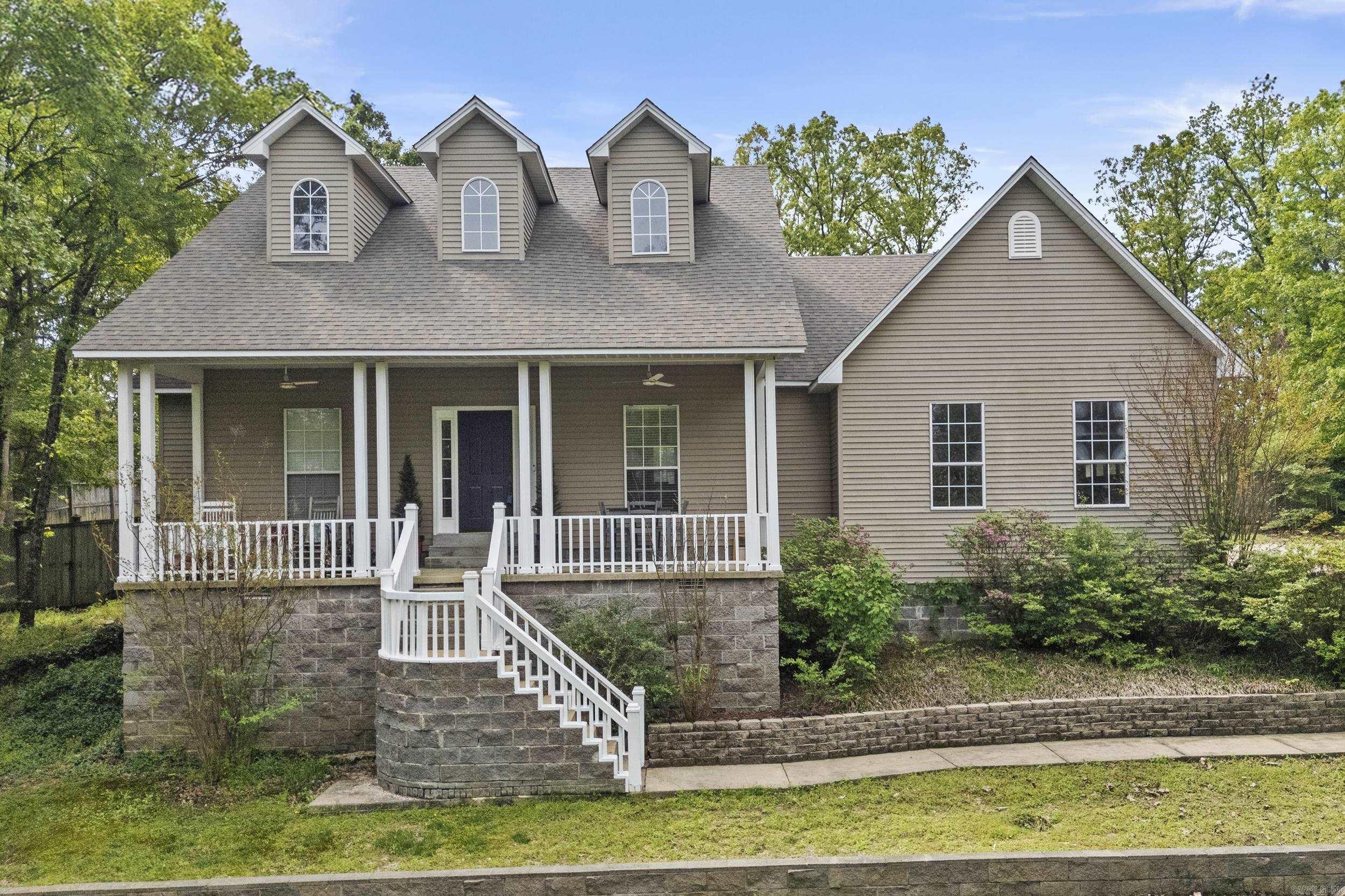 Welcome to this darling home nestled in the trees for exclusive privacy. This home has covered front and back porches to enjoying your morning coffee or watching the kids play. Open floor plan with vaulted ceilings, fresh neutral paint colors and hardwood throughout. Kitchen is large with wood stained cabinets, tile counter tops and a breakfast bar. Three full bedrooms with split floor plan. The master is large has his/her sinks, jetted bath tub and shower. Separate laundry room. Side entry garage. Fully fenced back yard.