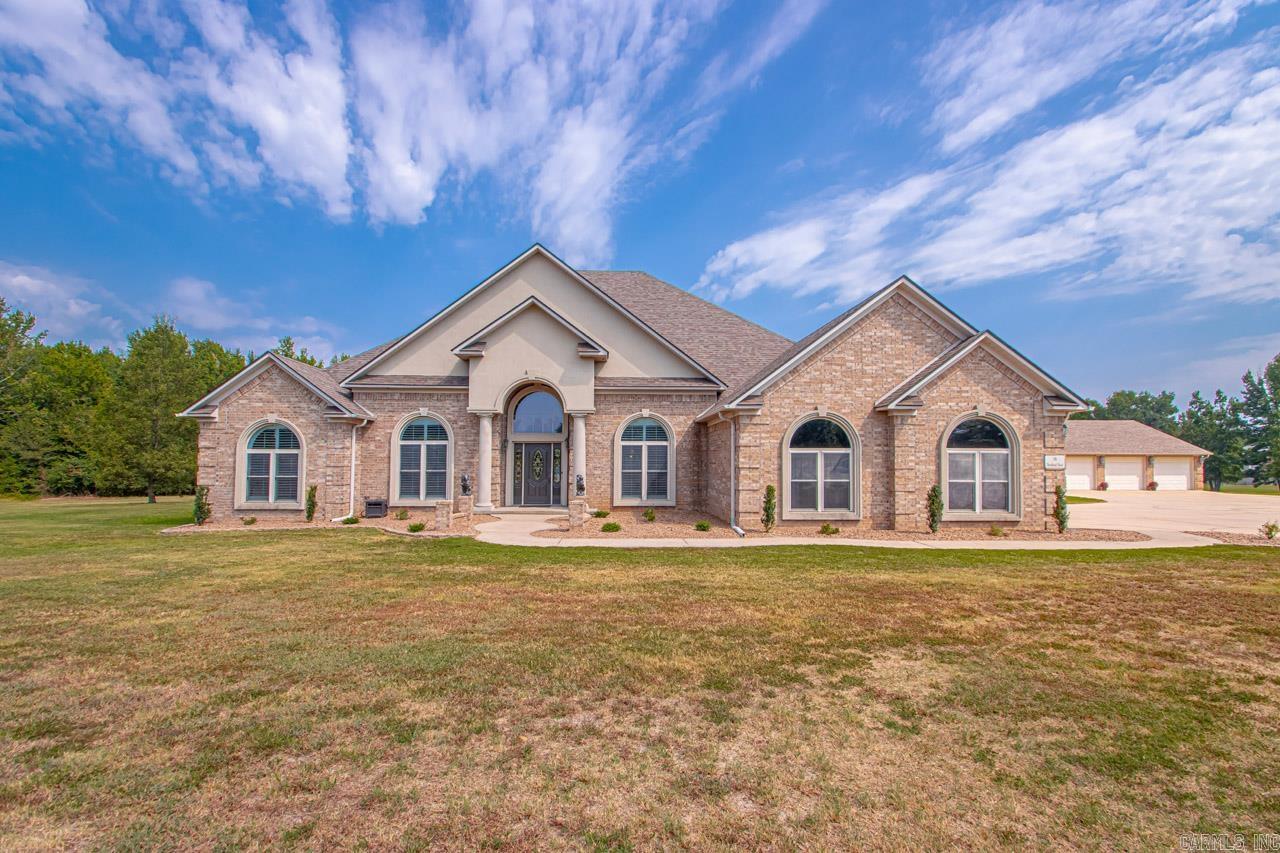 GORGEOUS CUSTOM BUILT HOME NESTLED ON 26.25 LEVEL ACRES! NOT IN SUBDIVISION!!! Public water and septic system. This home is all ONE LEVEL, 4 bed/4 bath (+1/2 Bath in SHOP area), with large garages to park several vehicles. Beautiful GOURMET KITCHEN with granite slab counters/island, breakfast bar, dining area, wall oven, amazing and spacious cabinetry! SAFE ROOM, laundry room, elegant large primary bedroom, 3 guest bedrooms, office, 4 fireplaces, new roof in 2022, custom (2) 99% clean air heat/air units, central vac, fenced in SALTWATER POOL, STOCKED POND, outside COVERED pavilion/kitchen/porch! OUTSIDE FIREPLACE, LARGE SHOP (partial heat/air,) 1/2 bath, with covered area for tractor/vehicle. Fencing throughout the property. Bring your livestock! Fish/Cruise the pond! Swim in the pool! Gardening! Watch the abundant wildlife! So many possibilities! FIBER OPTIC INTERNET available! A long concrete driveway, leads you to this beautiful home. Once you have entered the PRIVATE GATED ENTRY, onto the estate, it makes for a majestic experience! Home is in immaculate condition and ready for you to enjoy! CALL US TO VIEW THIS AMAZING HOME!!! AGENTS, PLEASE SEE REMARKS.