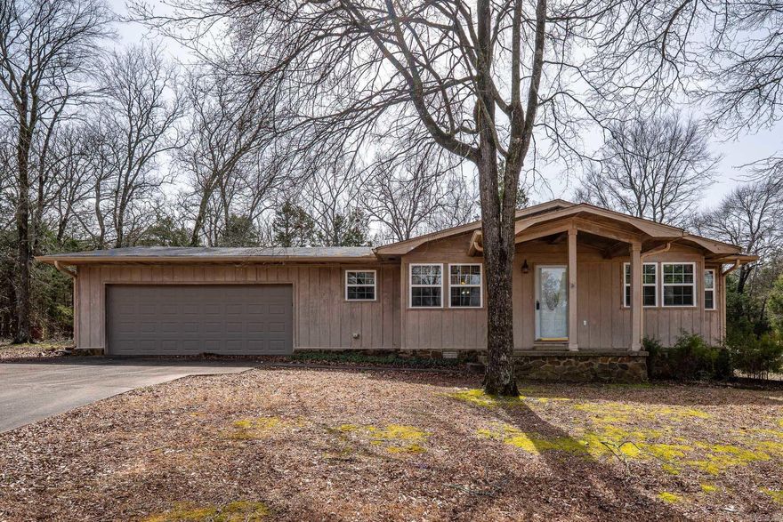 3 bed 2 1/2 bath in a booming area. Newer cabinets in kitchen and huge island with open floor plan. Separate dining room that could be used as 2nd living room. House is sold as is/ where is. Beautiful land with peaceful and quiet surroundings! Fully fenced and on Conway Corp! Do not walk on deck as it will fall in.