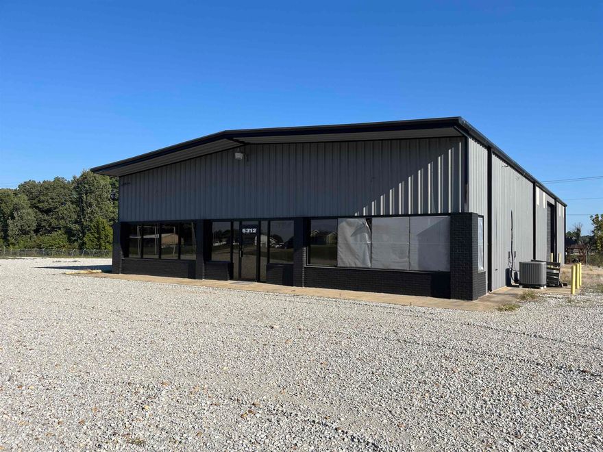 Rare commercial opportunity on 4.12 acres at a high-traffic corner of Stadium Blvd and Old Hwy 163. This multi-parcel listing includes 5306, 5310, and 5312 Stadium Blvd—formerly the Jonesboro Tractor Sales dealership. The property features four metal buildings totaling over 10,600 sq ft, including showroom, service garage, and warehouse space. Improvements include security fencing, multiple illuminated signs, concrete paving, and lighted canopies. Zoned C-3, this site is ideal for redevelopment into a C-store, automotive use, retail hub, or other commercial ventures. Excellent road frontage and visibility in one of Jonesboro’s most active corridors. Call today for more details.