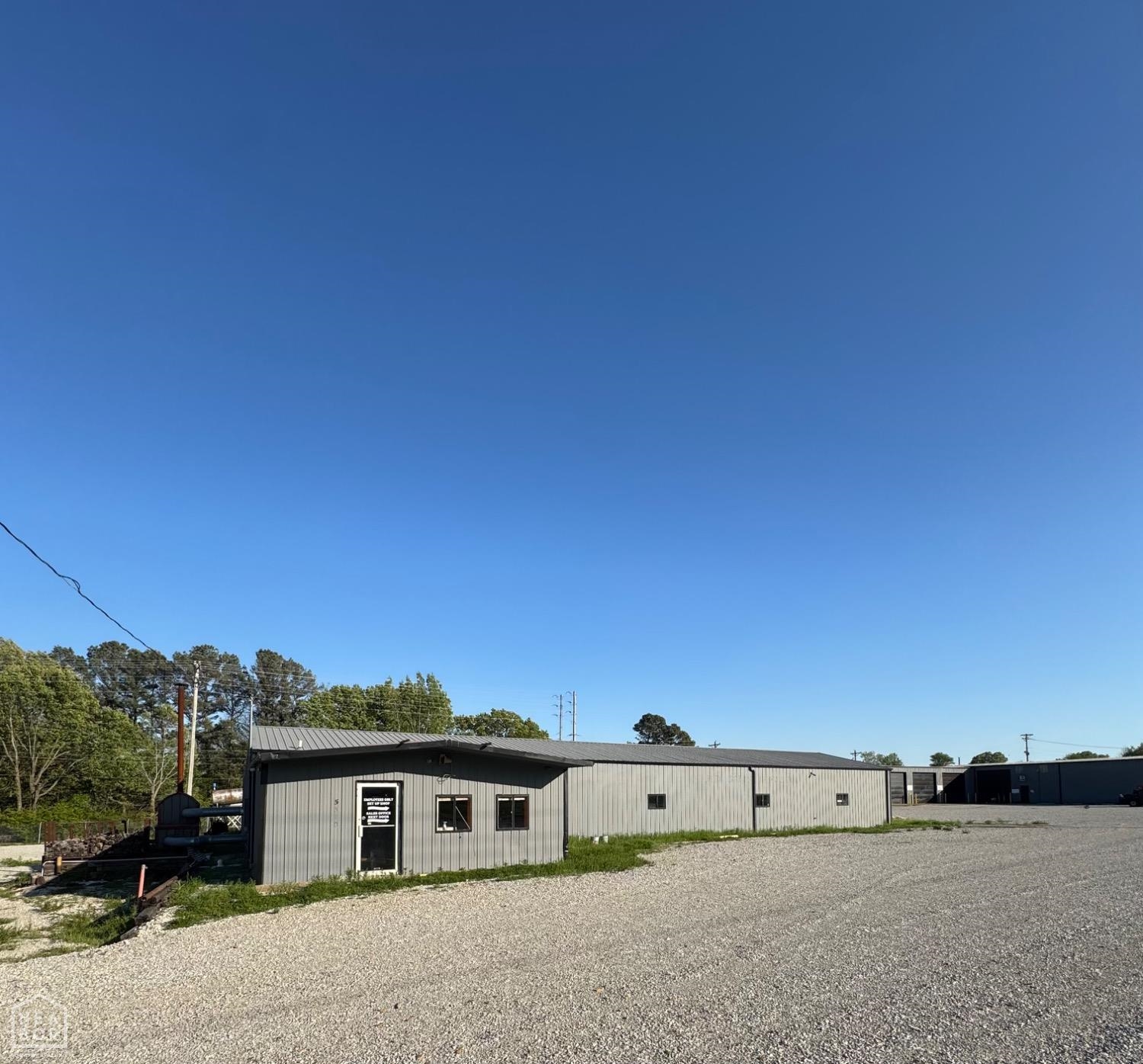 Rare commercial opportunity on 4.12 acres at a high-traffic corner of Stadium Blvd and Old Hwy 163. This multi-parcel listing includes 5306, 5310, and 5312 Stadium Blvdāformerly the Jonesboro Tractor Sales dealership. The property features four metal buildings totaling over 10,600 sq ft, including showroom, service garage, and warehouse space. Improvements include security fencing, multiple illuminated signs, concrete paving, and lighted canopies. Zoned C-3, this site is ideal for redevelopment into a C-store, automotive use, retail hub, or other commercial ventures. Excellent road frontage and visibility in one of Jonesboroās most active corridors. Call today for more details.