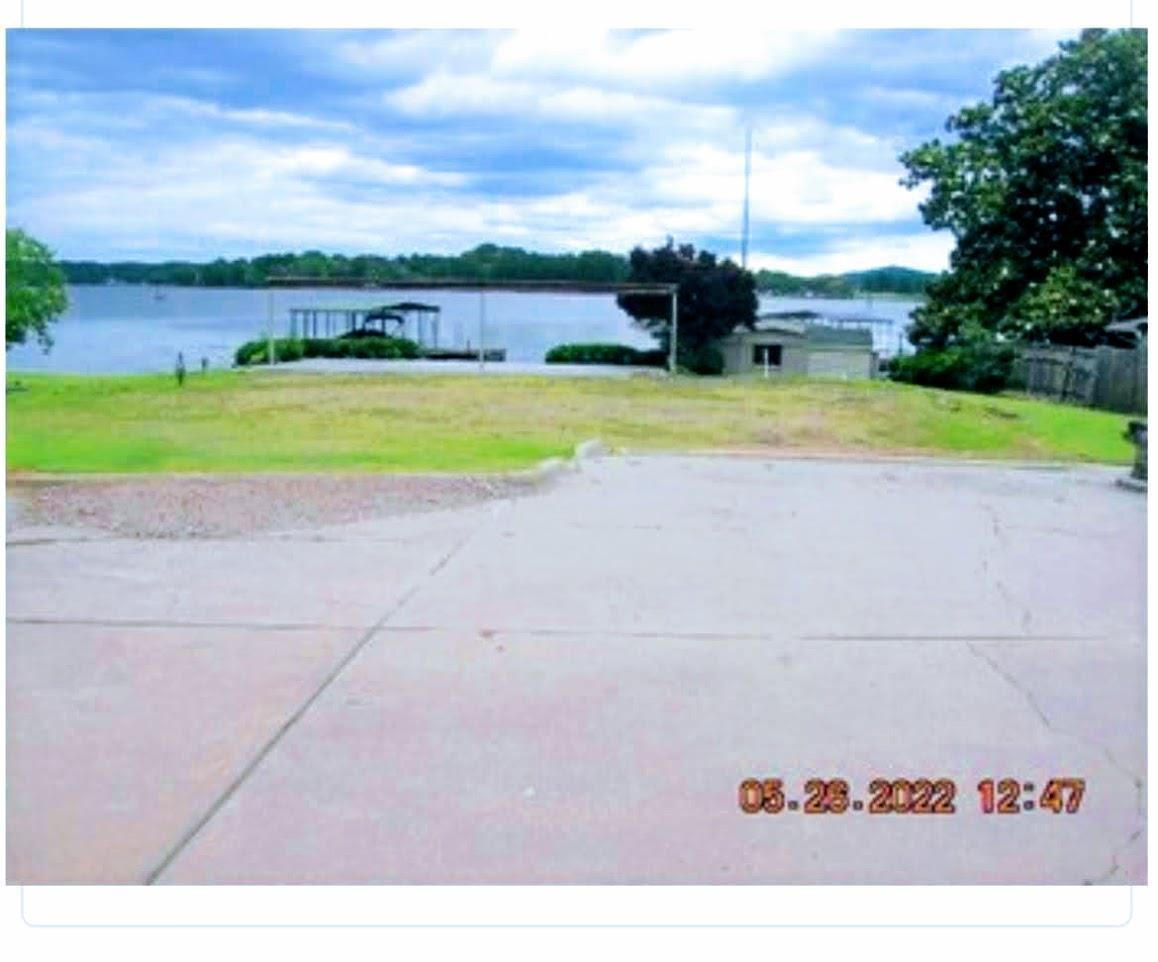 Awesome views of Lake Hamilton! From this level lake lot that is ready to build your dream home. Includes covered boat dock.