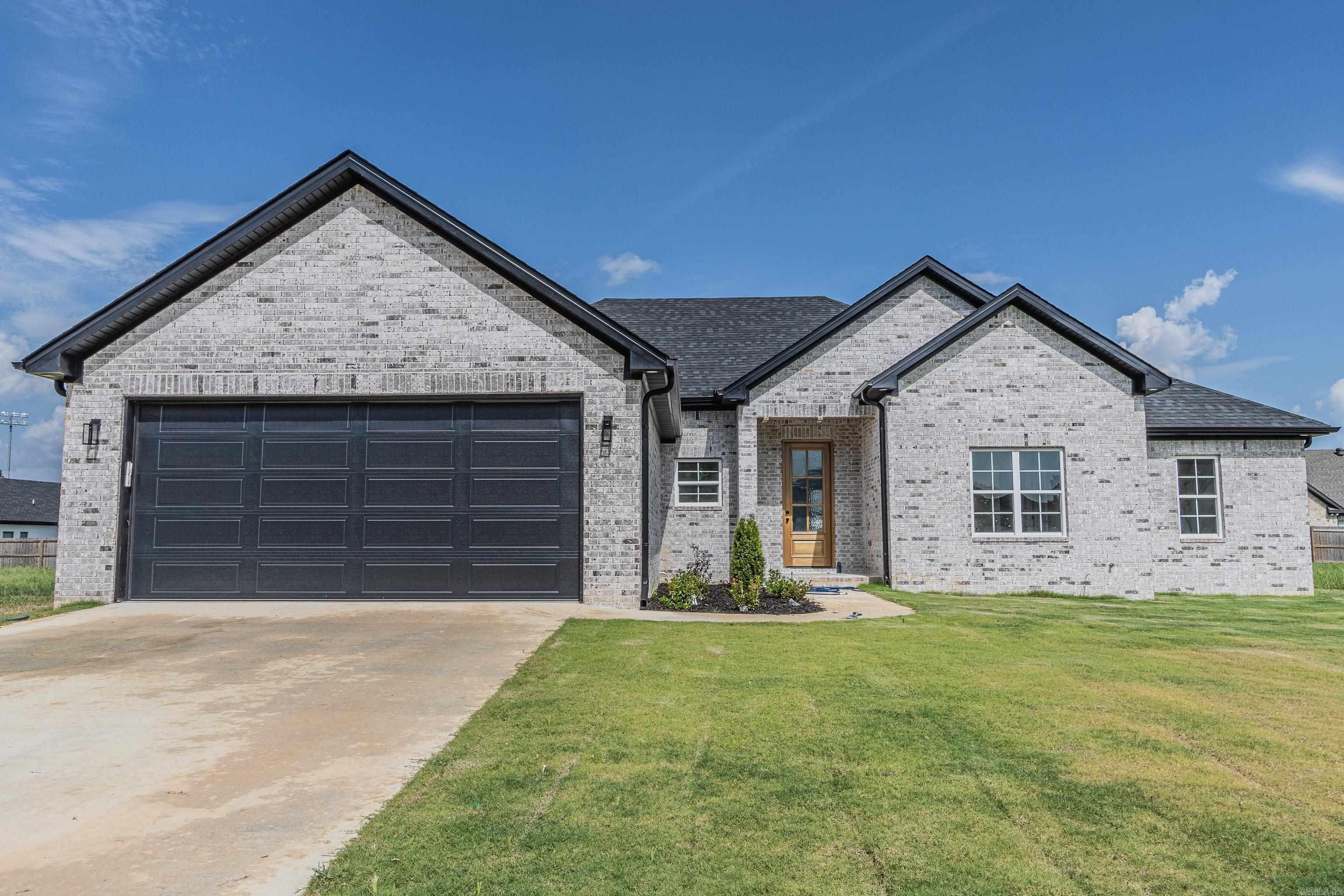 New Construction in Silo Ridge Subdivision! This 4-bedroom, 2-bath home offers 2,300 sqft of modern living space. Features include durable LVP flooring, stylish tile bathrooms, and a beautiful stone fireplace in the living area. The kitchen is equipped with white oak cabinets and quartz countertops for a clean, elegant finish. All-electric home with a brick exterior, built-in safe room, and located in the Greene County School District. A perfect choice if youāre looking for a brand-new home with quality finishes and thoughtful design! **AGENT-OWNED**