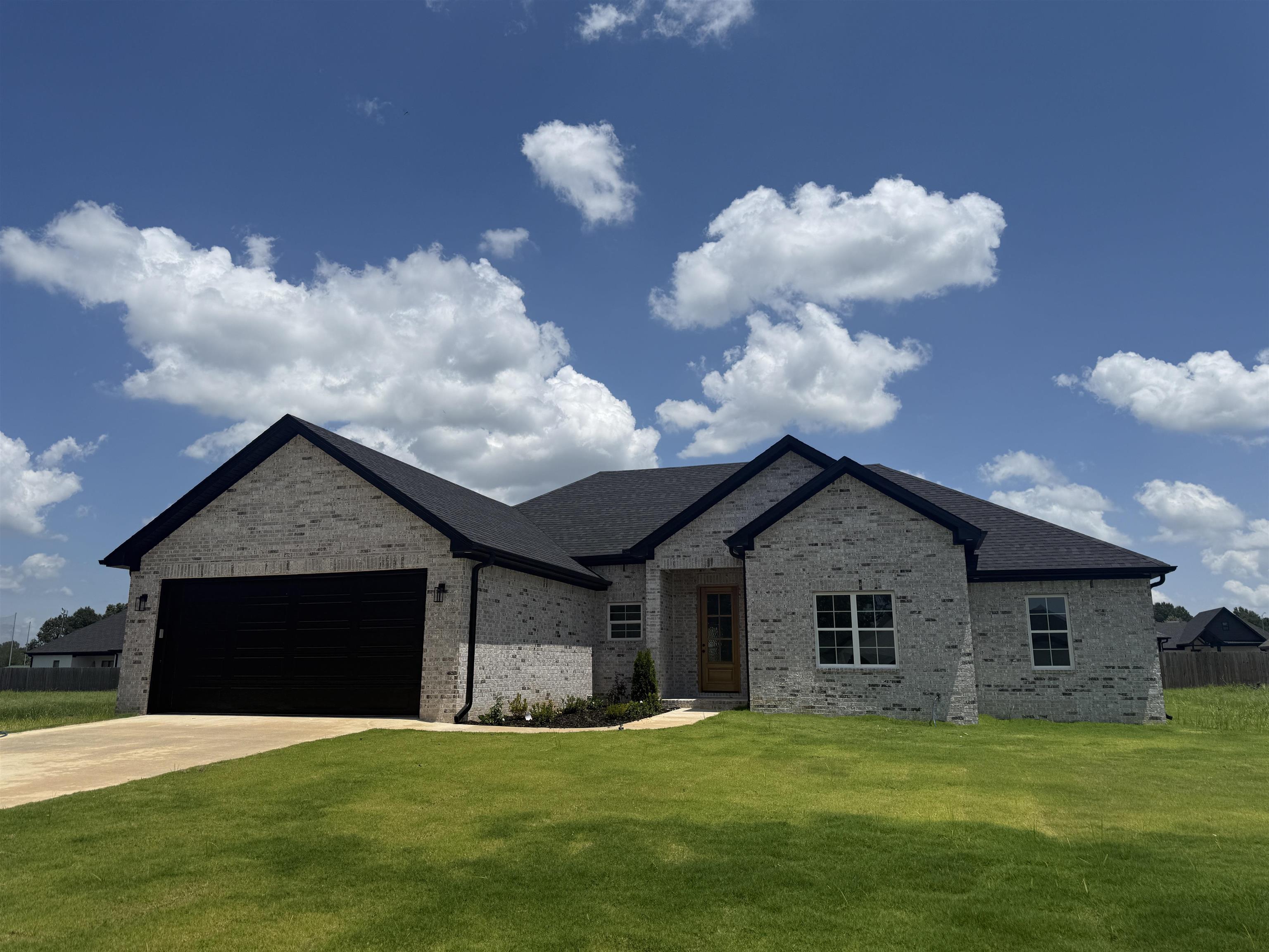 New Construction in Silo Ridge Subdivision! This 4-bedroom, 2-bath home offers 2,300 sqft of modern living space. Features include durable LVP flooring, stylish tile bathrooms, and a beautiful stone fireplace in the living area. The kitchen is equipped with white oak cabinets and quartz countertops for a clean, elegant finish. All-electric home with a brick exterior, built-in safe room, and located in the Greene County School District. A perfect choice if you’re looking for a brand-new home with quality finishes and thoughtful design! **AGENT-OWNED**