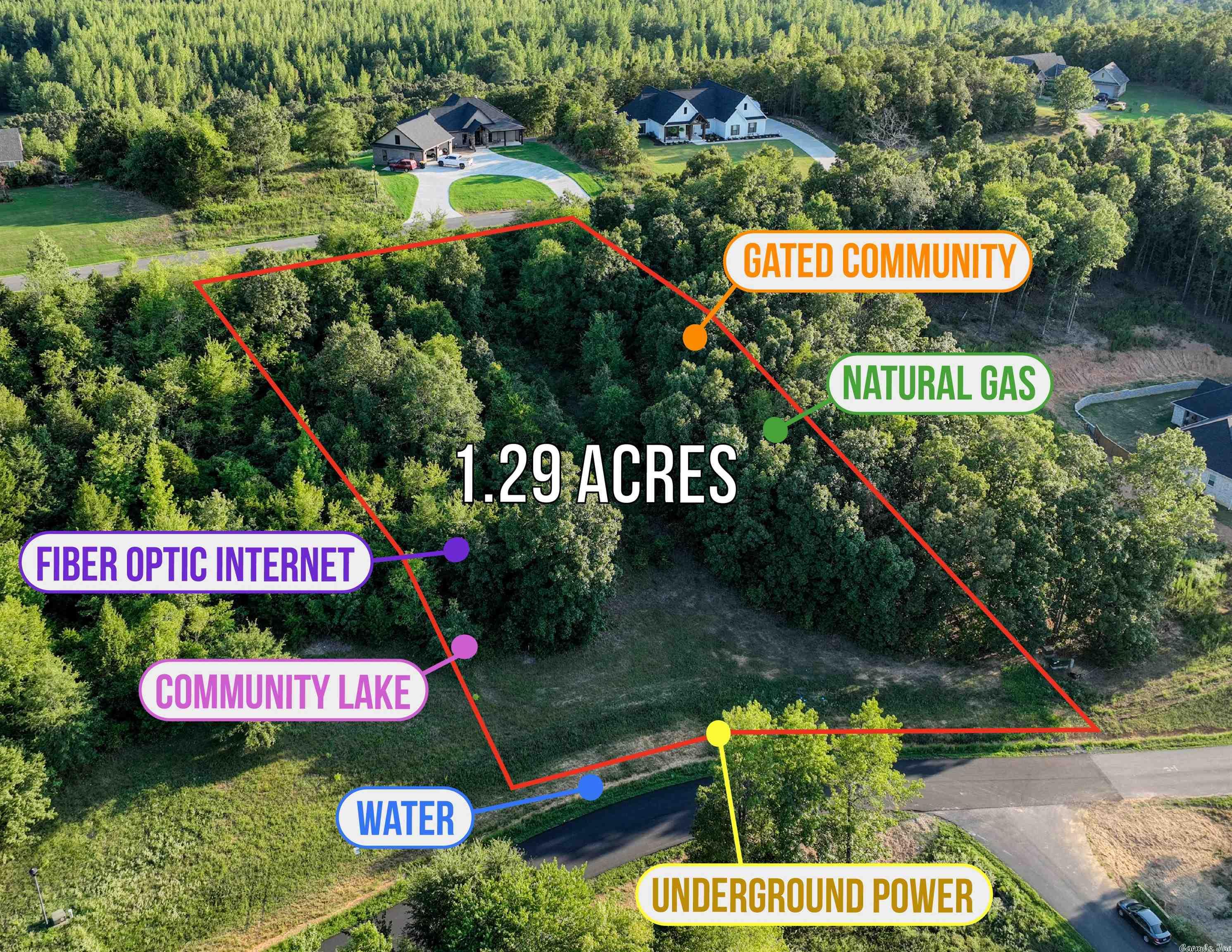 Gated wooded community with two entrances, underground power, water, natural gas and fiber optic internet. Community lake. Restricted to site built homes, 1850+ sq ft, no mandatory builder nor time to build.
