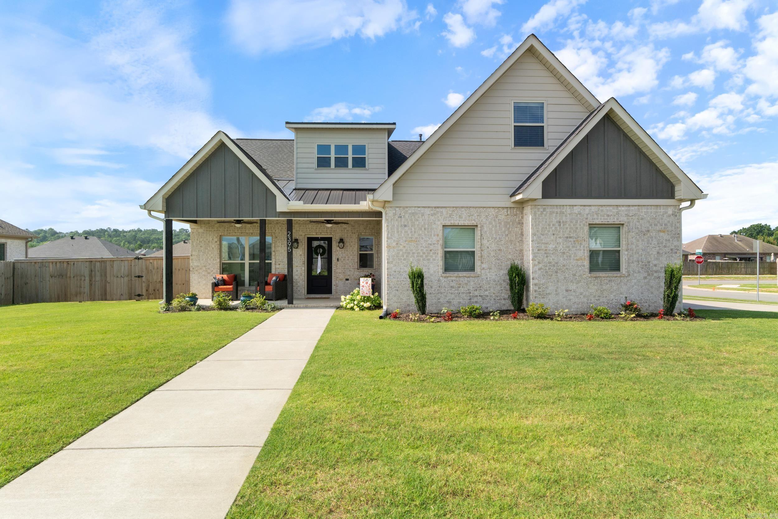 Welcome to this beautifully designed, turnkey, newer construction home in Ivy Place! Enjoy the seamless flow of the open-concept living area, highlighted by a soaring vaulted ceiling, stacked stone fireplace, and an abundance of natural light. A dream kitchen awaits with quartz countertops, high-end KitchenAid appliances, double convection ovens, a gas range, and a coordinating refrigerator that conveys with the home. A formal dining room or optional office space is just off the entry for added versatility. The spacious primary suite is located on the main level, featuring a spa-like ensuite with a relaxing soaker tub, walk-in shower, and a generously sized walk-in closet. Upstairs you will find the additional three bedrooms and two baths. The 4th bedroom includes its own private bath and is ideal as a guest suite, bonus room, or media space. Enjoy your mornings and evenings on the covered front and back porches, or entertain on the extended patio in your fully fenced backyard! This home has energy-conscious details including a tankless water heater, insulated windows and doors. Don’t miss this incredible opportunity, schedule your private showing today! (Agents see remarks)
