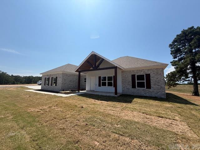 Fantastic new construction home on just under 1 acre. This home has some nice extras: Vaulted ceiling in the living room, attractive vent hood above the stove, electric fireplace, huge pantry, island, laminate vinyl plank flooring throughout and a large laundry room with lots of cabinets.