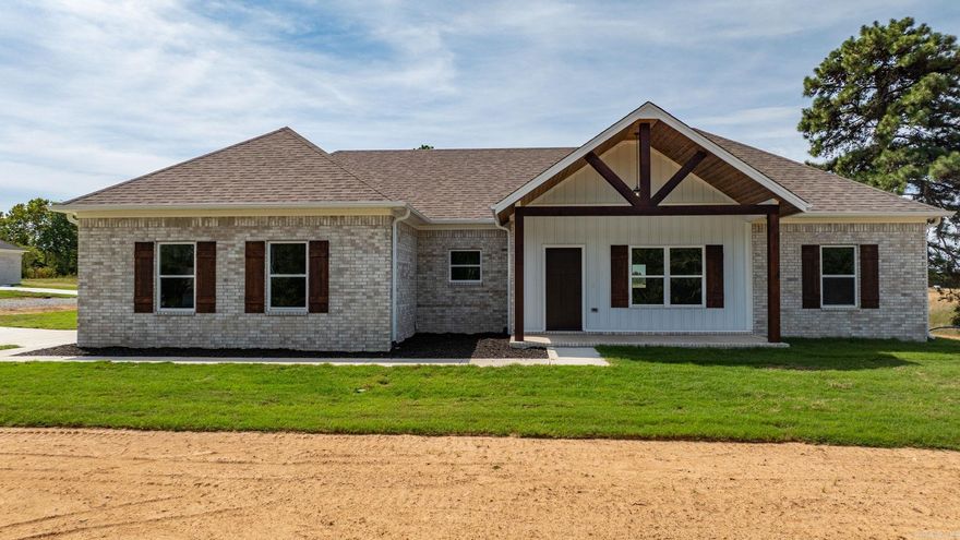 Fantastic new construction home on just under 1 acre. This home has some nice extras: Vaulted ceiling in the living room, attractive vent hood above the stove, electric fireplace, huge pantry, island, laminate vinyl plank flooring throughout and a large laundry room with lots of cabinets.