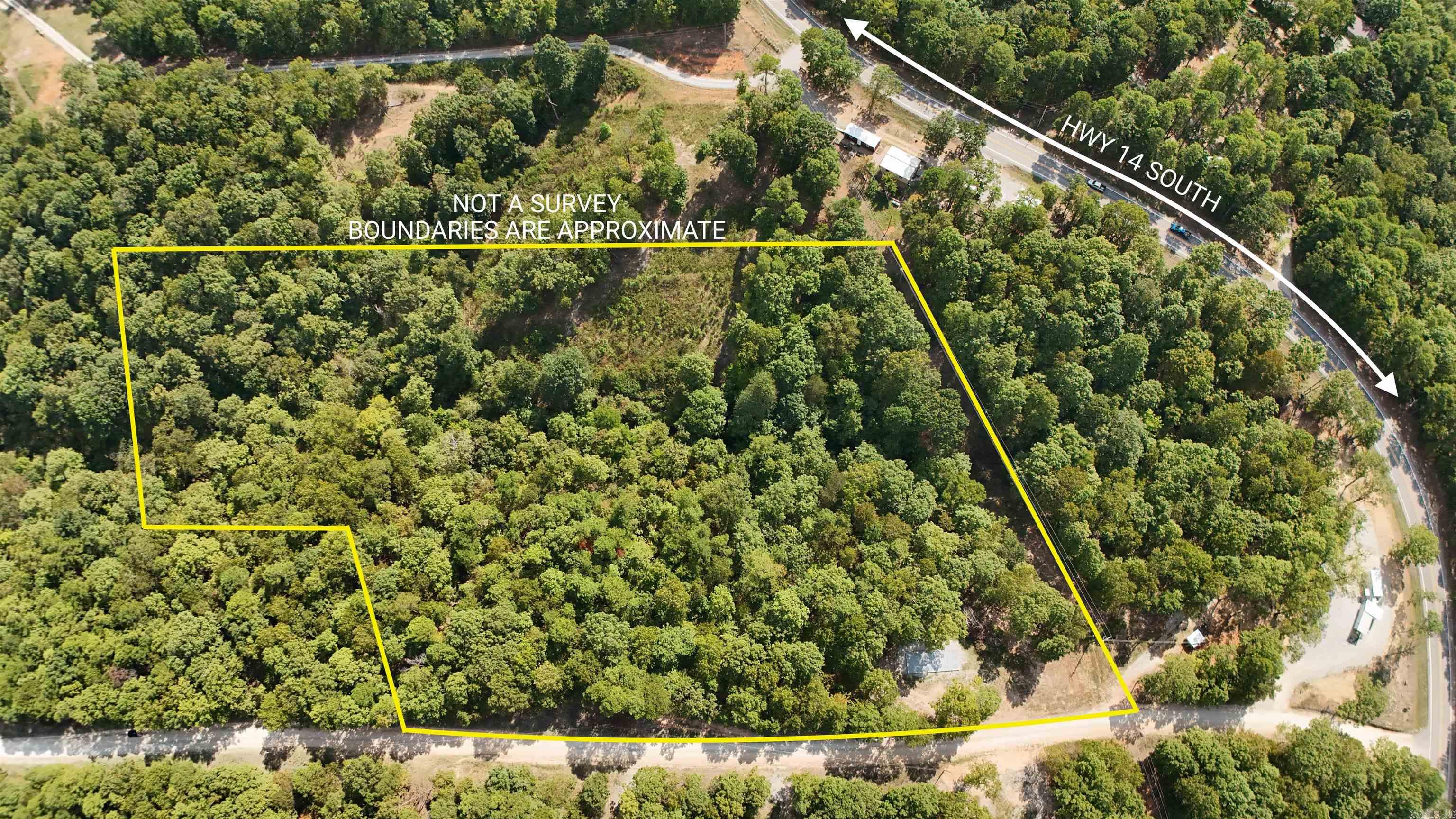 Escape to the heart of the Ozarks! This stunning 6 AC M/L tract offers a rare opportunity to own your own slice of paradise just off Highway 14 South in beautiful Yellville, Arkansas. Nestled among rolling hills, mature hardwoods, and serene natural beauty, this property provides the perfect setting for a private getaway, future homesite, or recreational retreat. Included is a 16 x 40 ft. pad ready for a two-story structure of your choosing. Property has access to City water as well as a spring, power and fiber optic. Whether you're looking for a nice place to build, a weekend escape, or investment land in a growing area, this property offers unbeatable value and natural beauty. Close to the Buffalo National River, Bull Shoals Lake, and countless outdoor recreation opportunities. Don't miss this one! Priced to sell quickly. Call for showing today!