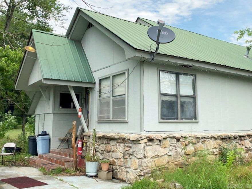 Home and income possibilities come with this house and 5-unit motel with opportunities for a beauty salon, office, etc. Total Square footage for Home/Salon/Motel is 3113 Sq. Ft. Two bedroom home could be converted to three bedrooms. Small shed for a workshop, storage, etc. Pretty park-like yard with room for your toys. Great location in small town on US Hwy 65 in the heart of the Buffalo National River country. Within 15-30 minutes of multiple landings on the river. Within an hour and 10 minutes of Bull Shoals, Table Rock, Taneycomo, Norfork and Greers Ferry Lakes, and the White and Little Red Rivers. Located within minutes of numerous camping, hiking, canoeing, hunting and sightseeing venues. Come check out this property offering a home and income stream opportunities! All #'s approximate. Acreage and age are estimates.