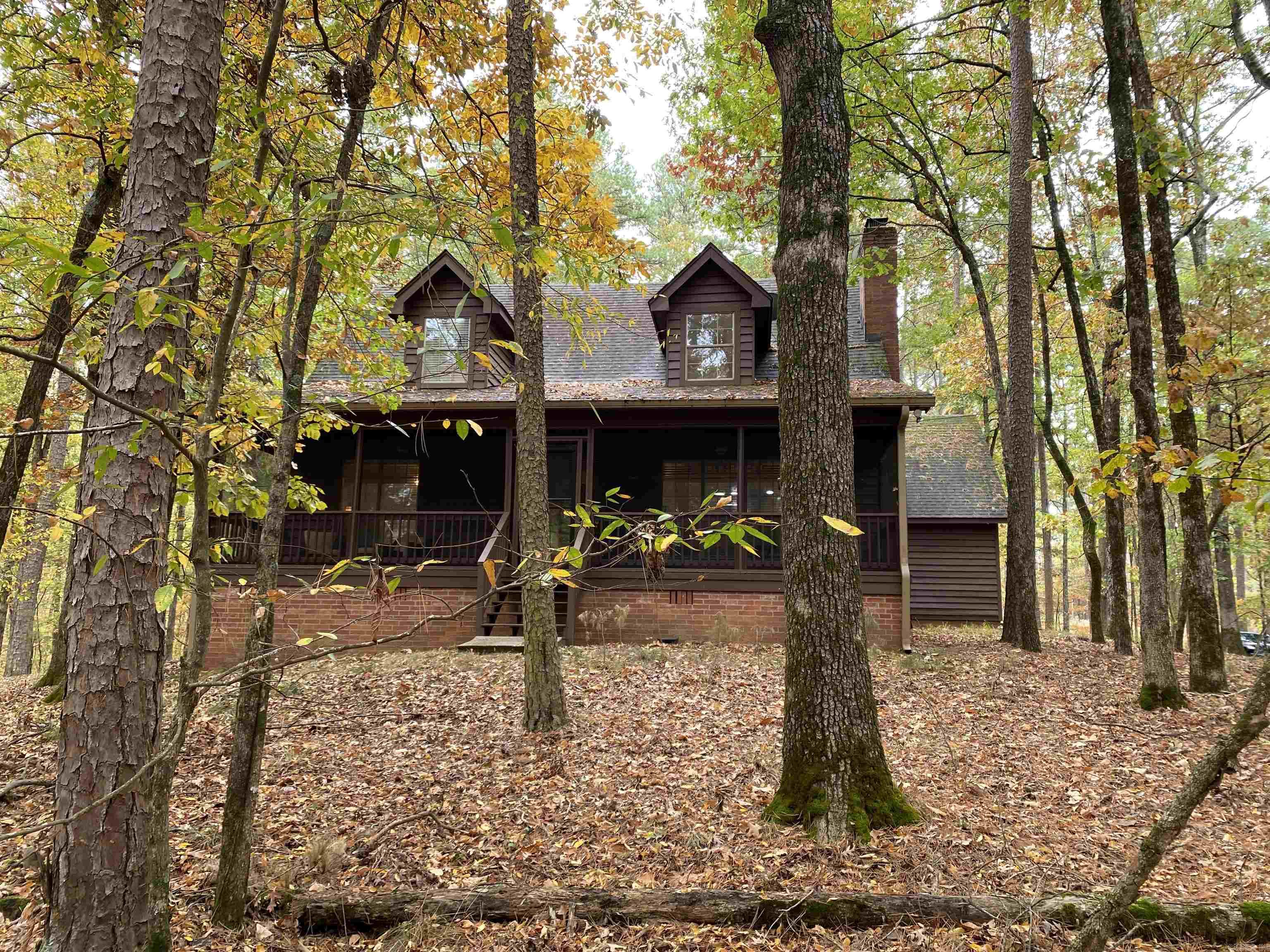 Beautiful cabin in the woods that has space for all your family and friends located at Mountain Harbor Resort. This furnished, 3 bedrooms, 2 bath, approx. 2,432 sq ft home has the open concept that makes hanging with your family and friends so easy. The large living area has a wood burning fireplace and is open to the kitchen which already has updated appliances and countertops. The sunroom is located off the kitchen with views of the forest and the wildlife that feed at the included deer feeder. Updates to the home include paved driveway, interior paint, exterior paint, bathrooms, enlarged back deck, screened front porch and more! Included with the home are 2 extra lots to ensure your privacy for a total of 4.66 +/- acres AND it backs up to the national forest. Call today for your private showing!