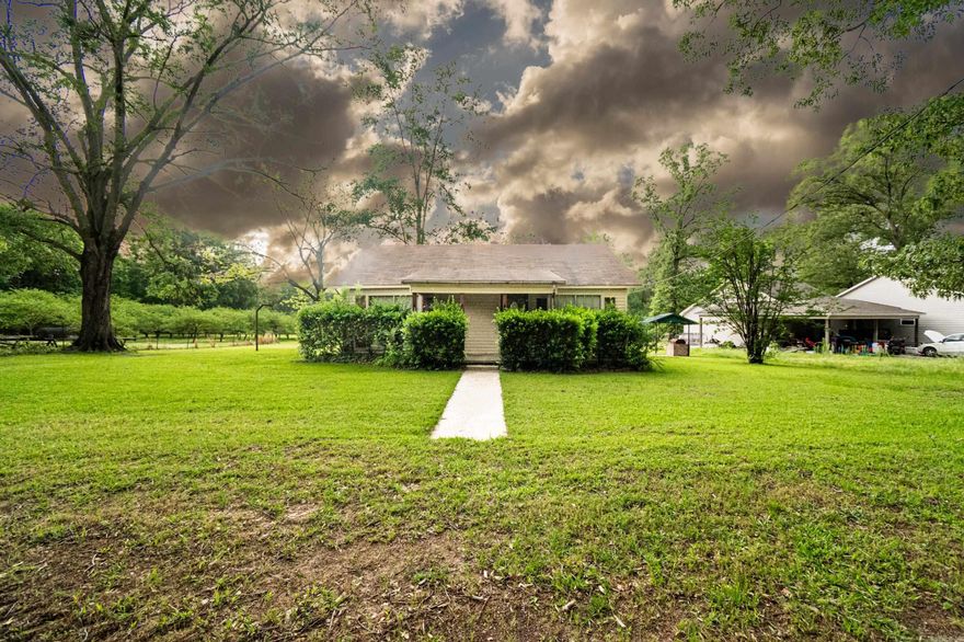 Nestled on approximately .55 acres, this unique property offers a 2-bedroom, 1-bath main home along with a guest house—perfect for those looking to renovate and create their ideal country retreat.  Can purchase the orchard and additional land (1.75 +/- acres) for $165,000. A standout feature is the largest mayhaw orchard in Union County, an established 20-year-old grove with multiple grafted varieties. This meticulously maintained orchard generates an annual income of approximately $18,000, making it both a scenic and smart investment.  Additional Opportunity: Adjacent to the property is Paul’s Welding Shop, also available for purchase. The shop includes an office and a full bathroom, along with the option to acquire additional acreage—ideal for expanding operations or additional development. Whether you're a homesteader, investor, or small business owner, this property offers both charm and potential.