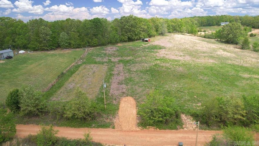 With power, water, and a new driveway into this unrestricted lot, you get to enjoy the freedom of the country without sacrificing modern conveniences.  -No Restrictions! -New Driveway -Power (on-site) & Water -Very Buildable: No Floodplain or Wetlands, Half Cleared -Livestock Shed -New Survey -Partially Fenced -Priced Well Below Market