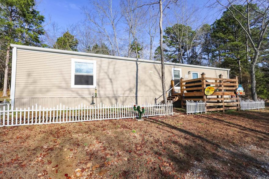This approx. 1.30-acre property features a 2023 single-wide mobile home offering 2 bedrooms and 2 bathrooms. Enjoy a screened porch, a detached 2-car carport, 2 storage sheds, and convenient RV parking. City utilities are available at both the mobile home and the RV site. With plenty of open space and versatile use potential, this property is being sold as-is. Motivated sellers make this a great opportunity to make it your own!