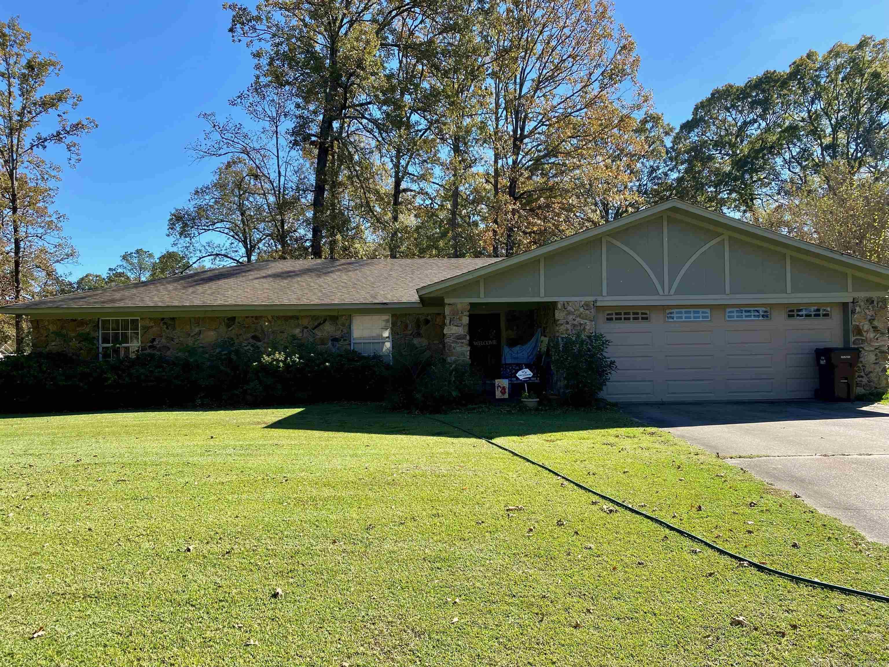 Beautiful brick home in a beautiful subdivision with a fully fenced yard. 3 bedroom, with large Master with walk in closet. A large shop with loft space big enough for a man, or woman cave, or both. Also there is a concrete drive from ally to the double doors on shop. A wood burning fireplace makes the living room nice and cozy in the winter. Nice entryway with closet and the living room has beautiful arches. There is also a nice pantry in kitchen as well as a newly remodeled powder bath as you come into kitchen through garage. Roof is 2008 Architectural. Heating/Air unit 2024.