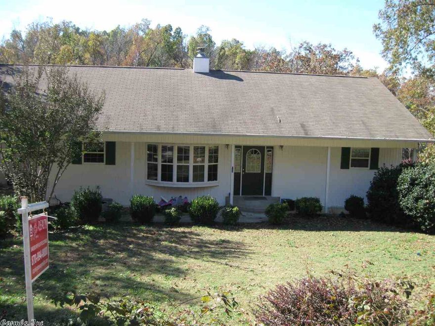 Built in 2001, this home has beautiful hardwood floors in formal dining room and breakfast area, open living area w/vaulted ceiling, large windows overlooking lake & native stone fireplace w/gas log, breakfast bar in kitchen, appliances included, nice master suite & laundry on main level. Finished walk-out basement has huge family room plus rec room, 2 bedrooms, full bath, workshop & storage room. Also has fenced back yard, wonderful landscaping, boat dock plus picnic table & swing at lake.