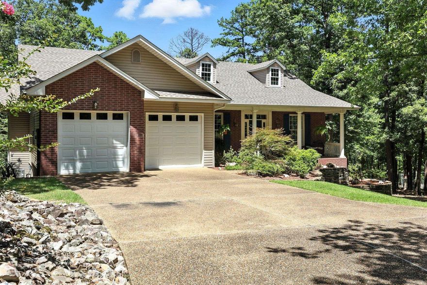 5.6 private wooded acres in Hot Springs Village! This beautifully remodeled home offers a rare blend of space, style, and amenities.  3 spacious bedrooms, 2 full baths, plus 2 convenient half baths. Formal dining room that could be converted to a fourth bedroom! A remodeled interior featuring quartz countertops, newer kitchen appliances, modern lighting, and elevated finishes throughout.  Versatile lower level with its own living area—ideal for guests, hobbies, or multigenerational living. Roof new in 2023, HVAC upper replaced 2021 lower replaced 2023 and water heater was new January 2023! Your own private tennis court and a dedicated workshop—perfect for creatives, crafters, or weekend DIY warriors.  With acres of room to roam and relax, this property is a sanctuary of possibility—whether you’re entertaining, unwinding, or diving into your next big project.  North America’s largest gated community is known for world-class golf, glimmering lakes, and miles of scenic trails, where you are surrounded by luxury and natural beauty!