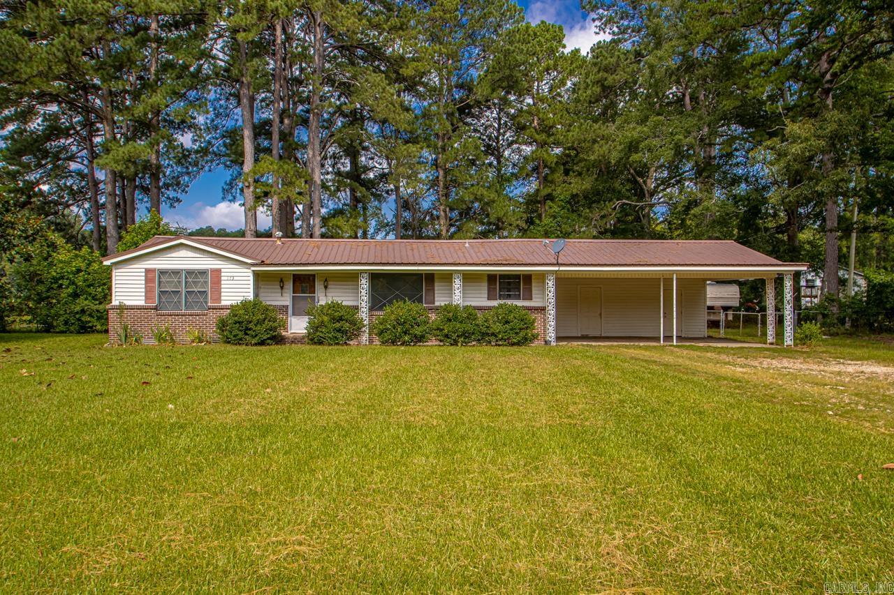 Rare Find at This PriceāOver 1 Acre Near Sheridan! Don't miss this incredible opportunity! This charming home sits on a spacious 1.18-acre lot, including a unique .18-acre pie-shaped parcel across the road. The huge fenced backyard offers ample room for kids, pets, or gardening, and includes a 40x24 wooden shop with a concrete floorāperfect for hobbies, storage, or a workshop. Enjoy covered parking with a 28x28 carport featuring a 24x6 storage area, plus peace of mind with a whole-home on-demand generator. The metal roofs on both the house and shop, and the newer HVAC system adds even more value. Inside, youāll find original hardwood floors, a large living room, cute dining area, and a spacious bathroom. All of this located just under 2 miles from the heart of Sheridan, offering the quiet of country living with easy access to town.
