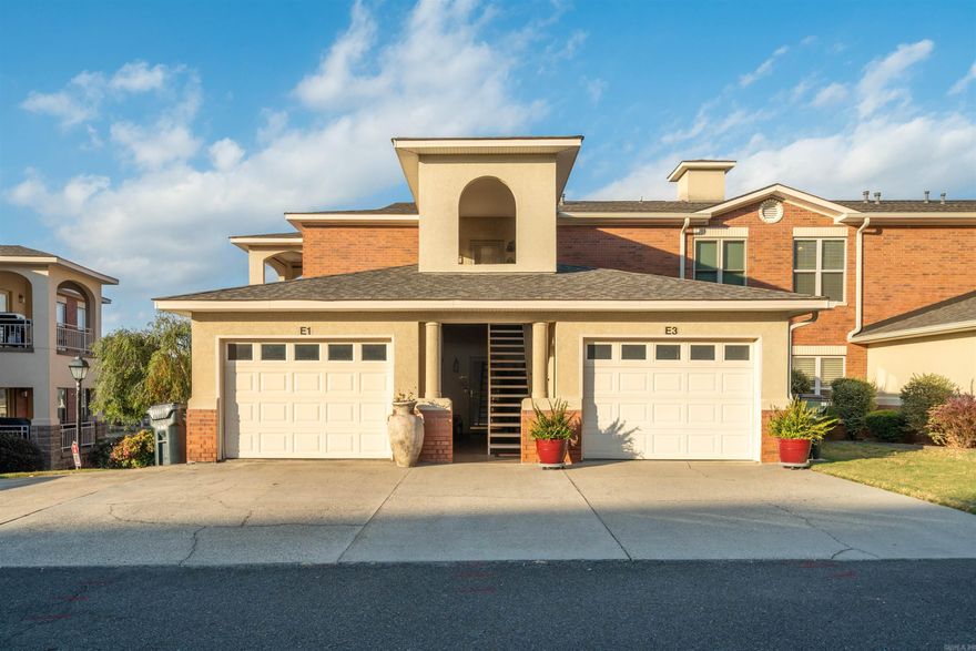 Lake life is calling! Tucked inside the gated Millennium Bay community on Lake Hamilton, this stunning waterfront condo puts you steps from the water with every amenity you could want. Sparkling pool, entertainment pavilion, community boardwalk, and boat launch all included.Inside, hardwood floors, lake views, and a built-in wet bar set the tone. Two fireplaces, two covered patios, an open floor plan, and a private garage make this as comfortable as it is impressive. Walk-in level access makes it effortless to come and go.Whether you're looking for the perfect weekend escape or a full-time lakefront lifestyle, this is it. Schedule your showing today!