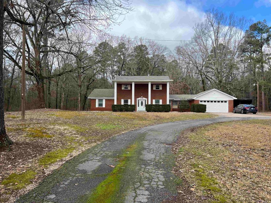 Beautiful 4 bed 3.5 bath brick home with bonus room.  This home has many new updates including some new flooring, paint, light fixtures and appliances, newer roof and many more.  The spacious master suite is located on the bottom level and there is plenty of room for a growing family with three bedrooms located upstairs. There are two living areas downstairs along with a formal dining room, two back porch areas perfect for a bbq grill and outdoor entertaining.  This home is a must see!