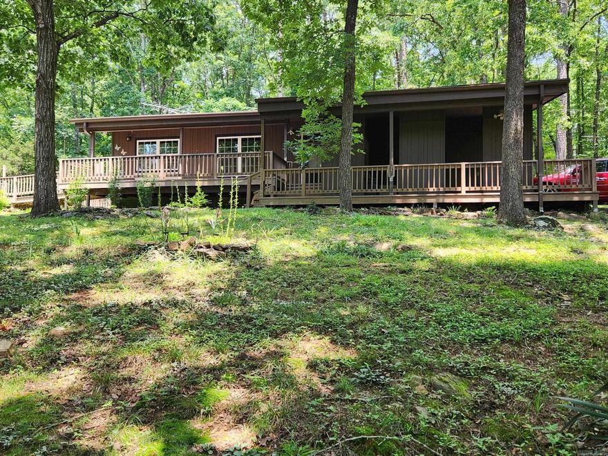 In the heart of Fairfield Bay nestled among the trees for complete privacy & at a dead end street that also adds to the secluded feel, lays this great home where you will enjoy the sights and sounds of wildlife but also realizing the safety of having neighbors you can't see.  Lounging on the covered front porch will be your new hobby & a enjoyable one at that.  Nearly new appliances remain which includes washer/dryer/refrigerator along with the range, microwave & dishwasher, new cabinets with pull-outs, composite countertops & tile black-splash, newly remodeled bath that will delight you, WB fireplace with circulating vents, generator wired, 14x24 heated/cooled workshop/craft rm or even could be used as extra sleeping space, gazebo & garden space. A short golf cart ride to golf course, many ATV trails to enjoy, swimming pools, tennis courts & pickle ball.  Don't forget the wonderful Gym very near and a senior citizen center if you are so inclined. Harps Grocery Store, restaurants, gas stations all for your convenience.  FFB dues only $113 monthly includes trash pickup.