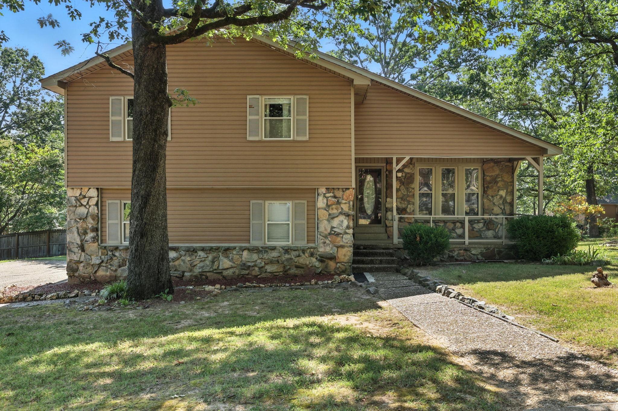 Welcome to 2 Millstone Cove in Maumelle! This beautiful 3 bedroom, 2.5 bath home spans 1,689 square feet and features fresh paint throughout, updated kitchen with elegant new countertops, a modern refrigerator, a mix of hardwood, laminate, and tile flooring, and a large wrap-around deck perfect for outdoor entertaining. Local amenities include, walking/bike trails, swimming pool, golf, tennis and picnic areas. This beautifully updated home is move-in ready and waiting for you!