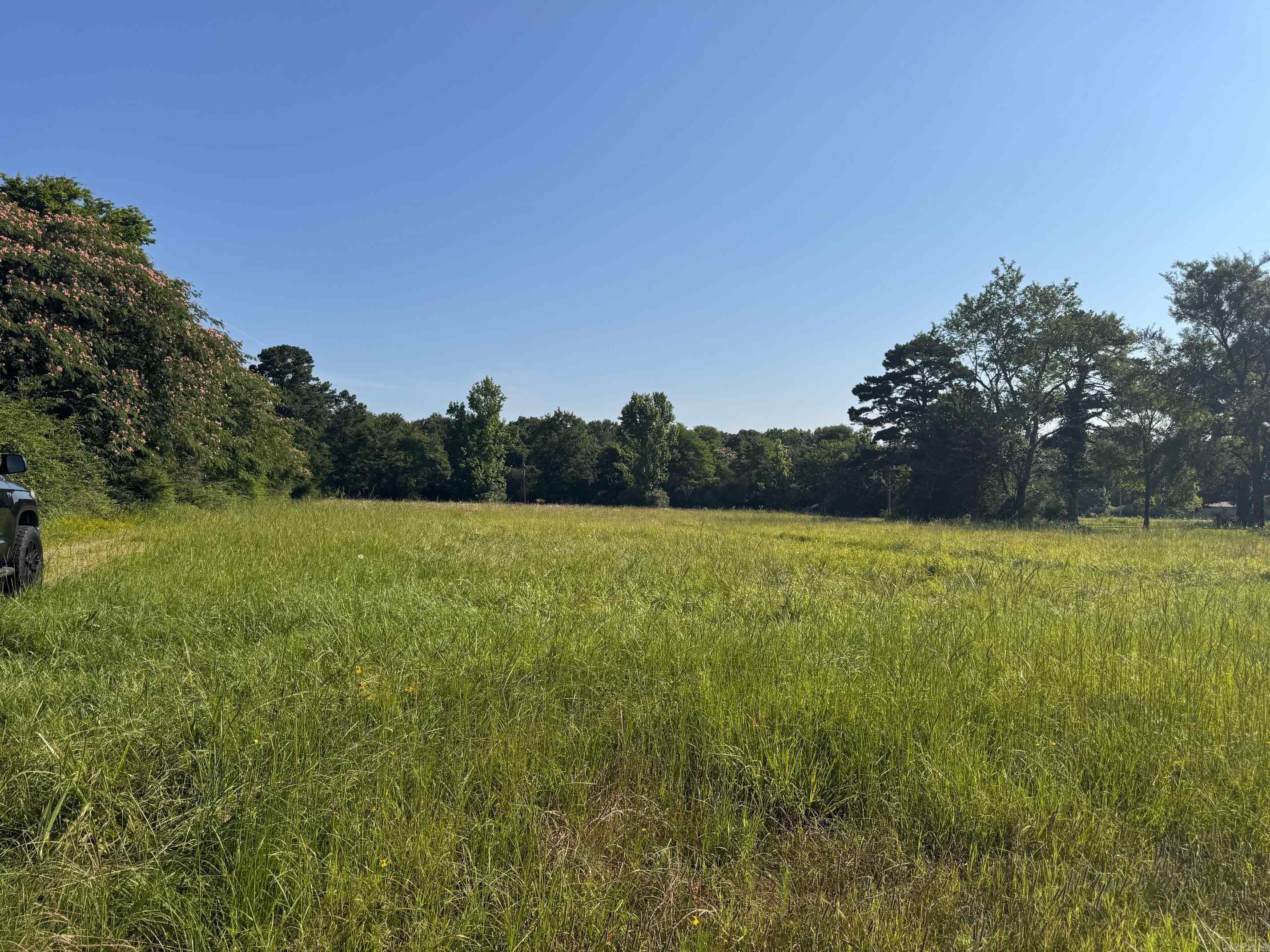 Approx 10 acres of vacant land located in Judsonia. Great location close to Searcy and shopping. Exact acreage amount to be determined by new survey, to be completed prior to sale. Front of acreage is cleared and has frontage on Hwy 13/Missile Base Rd. Approx the back half is wooded. Power and water are at the property, along with a water well. (Driveway has mailbox with address of 1018 Missile Base Rd.) AGENTS SEE REMARKS