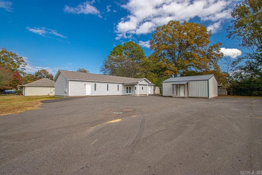 Offering nearly 2,500 square feet, this property includes an additional 736-square-foot building adding valuable versatility. NEW ROOF in May 2024 on both structures. The main building features an office, a spacious area that can be divided into additional offices or repurposed as a playroom, a full kitchen, and two bathrooms—one with two stalls and the other with a single stall. Whether continuing as a Church or transitioning to a variety of business uses, this flexible space provides exceptional potential for your vision!