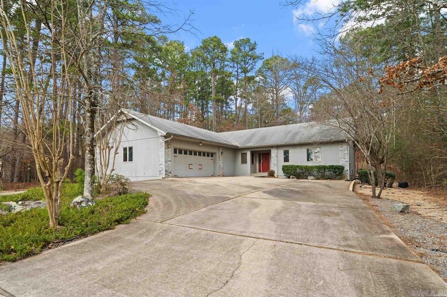 Beautiful one-level home in the gated community of Hot Springs Village. This home is located just two minutes from the Lake Pineda boat launch. This 3-bedroom, 2.5-bath home offers 2,217 square feet of comfortable living space. One bedroom features an additional adjoining room, perfect for a home office, sewing room, or hobby space. Enjoy relaxing in the sunroom overlooking the backyard, ideal for year-round enjoyment. The sunroom also features a bar area complete with a mini refrigerator, perfect for entertaining. A two-car garage and circular driveway provide ample parking and convenience.