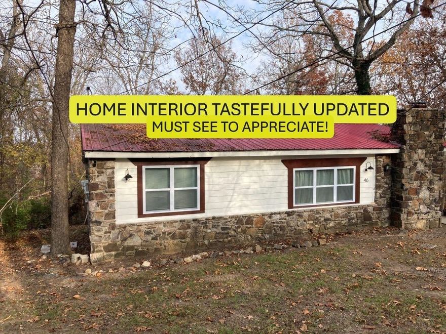 All new UPDATED INTERIOR in this 2-bedroom, 2 bath home with metal roof and seasonal views from the back deck. Ceramic wood-looking tile flooring throughout the house and a wood burning fireplace with a new Ashley wood burning insert with blower in the living room to keep the home toasty warm on those chilly winter nights. All New appliances (2024) stay with home, including the refrigerator.  Kitchen is open to the living room and dining room with new lighting & ceiling fans throughout the house making the home fresh & bright. All the plumbing has been updated with Pex & PVC and the electrical has been updated with a new 200-amp breaker box. The LARGE Primary Bedroom has a newly updated 3/4 bathroom with beautiful walk-in shower. The washer & dryer (also new in 2024) are included in the spacious laundry, where you will also find a new in 2024 water heater, new water softener, and whole house water filtration system. Ownership gives you access to 7 Lakes, 2 18-hole golf courses, Southfork River, 2 Recreation Centers among other amenities. $109,000. #2422