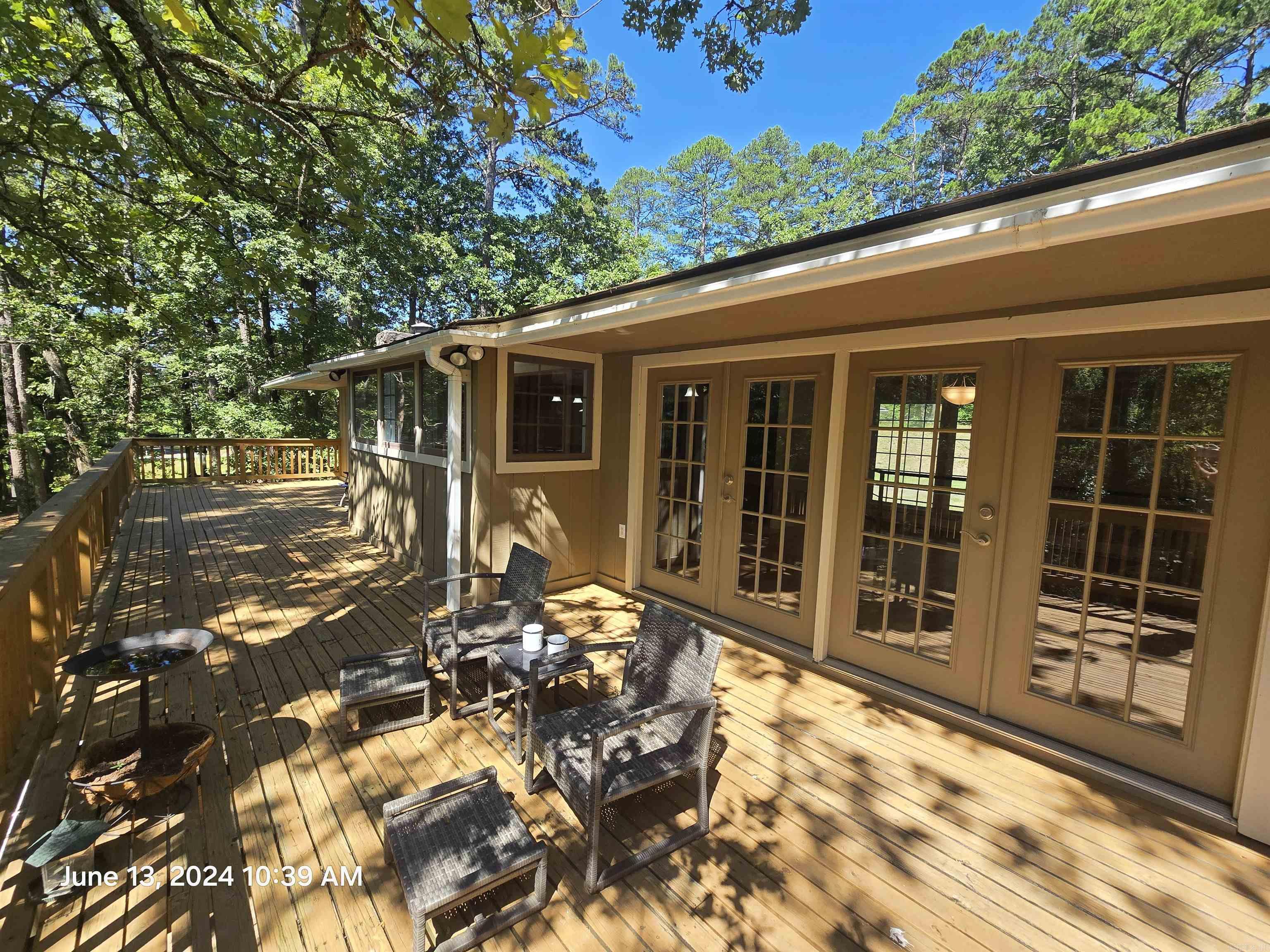 Country living at its finest in this country home! Enough space for 2 families! Master suite on main floor with 3 other bed & bath on same floor on the other end of home. Beautiful kitchen (new fridge matching black appliance's) overlooking a peaceful green county setting with a creek that feeds into the pond at the end of the property, back inside home offers real wood floors expand across the home, tile in the bathrooms, large tile walk-in shower with a jacuzzi soaking tubs in both bathrooms! Two separate French doors lead out the large deck that stretches near the entire back of the home from there you can enjoy the pond. Downstairs offers an expansive living area, large enough to add a kitchen & dining area. It offers a fifth bedroom and the 3rd full baths & Jacuzzi tub.