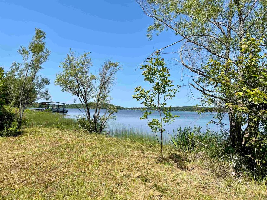 3 m/l Acres on Crown Lake for sale in Horseshoe Bend Arkansas, Izard County. Nestled in the Ozarks you will find this park like setting property very gentle rolling, approximately 1/2 cleared and 1/2 wooded with some very large mature trees, great homesite spots with approximately 192+ feet of water frontage. There are numerous dogwood trees, redbud trees, hibiscus, iris and honeysuckle which are gorgeous when in bloom!  Located on Crown Lake which is over 600 acres to boat, jet ski, canoe, paddle board, fish or just cruise around from the CONVENIENCE of your own backyard! Several restaurants nearby including Papa Dicks Pizza in the Crown Point Resort, VITOS Asian kitchen, Taco Tribe and Calabama Restaurant for your dining enjoyment.    Conveniently located near Horseshoe Bend Municipal Airport (for small aircraft), Box Hound Marina, Crown Point Resort which has a brand NEW WATER PARK, NEW RV PARK, 2 golf courses (Turkey Mountain and Cedar Glade par 3) as well as hiking & biking trails.   LAKE LIFE AT ITS FINEST!