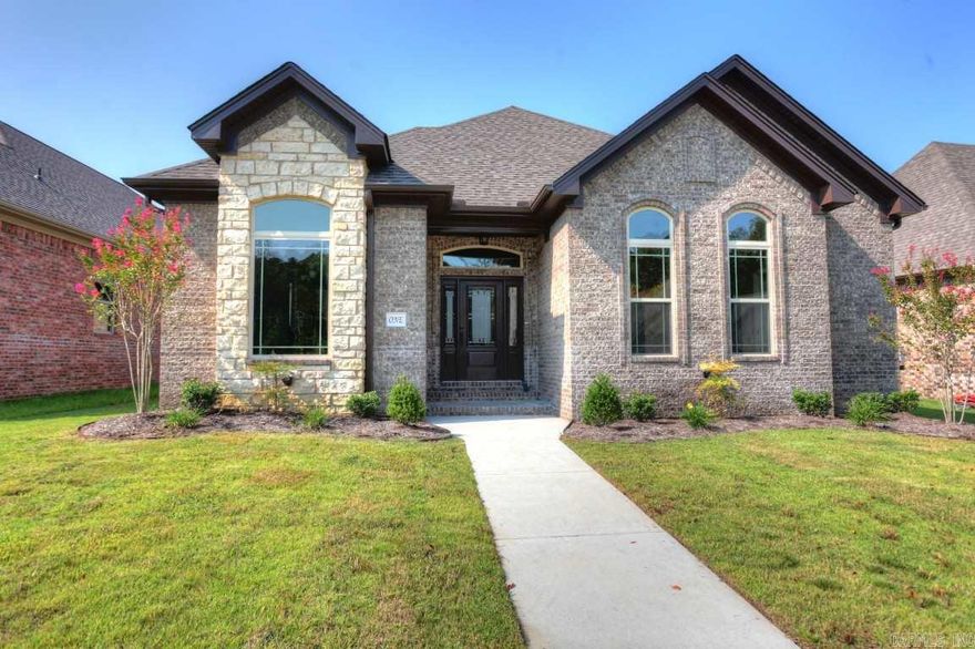 FABULOUS NEW CONSTRUCTION - Ready for new owners!  Beautiful detailing and finishes throughout.  Hardwoods throughout living, kitchen & hallways - Tile in baths.  Nice master suite with tile surround shower and expansive closet space.  Spare bedrooms are spacious with great closet areas.  Covered concrete back patio.  Kitchen has great details with large center island; beverage cooler; stainless vent-a-hood; granite and glass/stone backsplash.