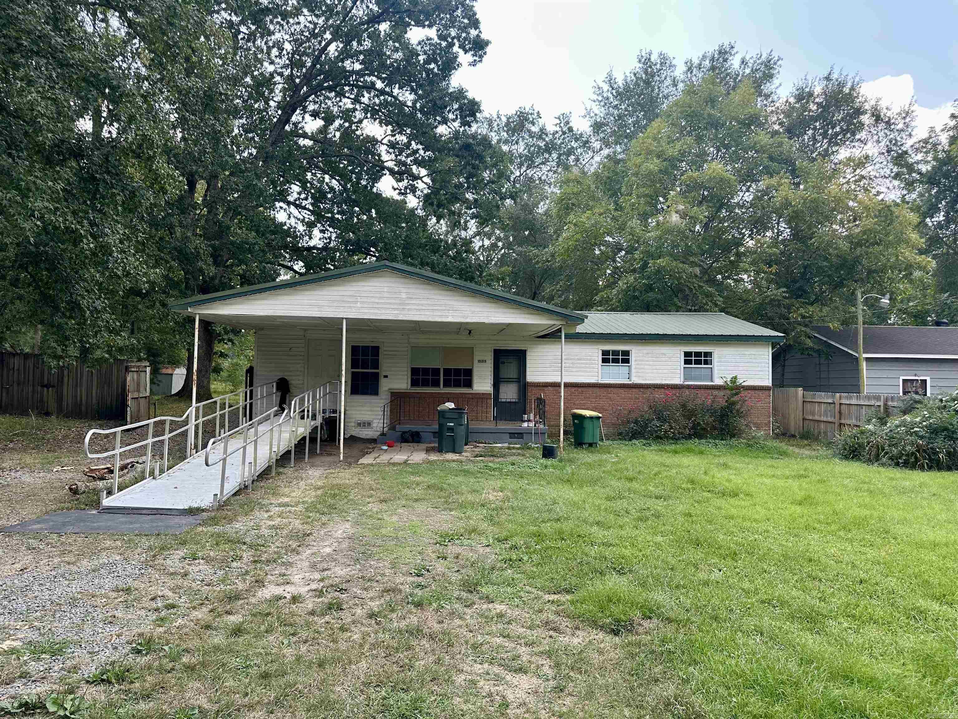 Lots of opportunity with this property! 4bed/2bath on one level with an apartment/in-law quarters with seperate entrance as well! Two large shops, flat lot and convient to all amentities. Right down the street from the new High School!